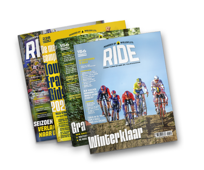 Three cycling magazines stacked, with the top one featuring a group of cyclists riding on a dirt trail under a blue sky and the headline 'winter klaar'.