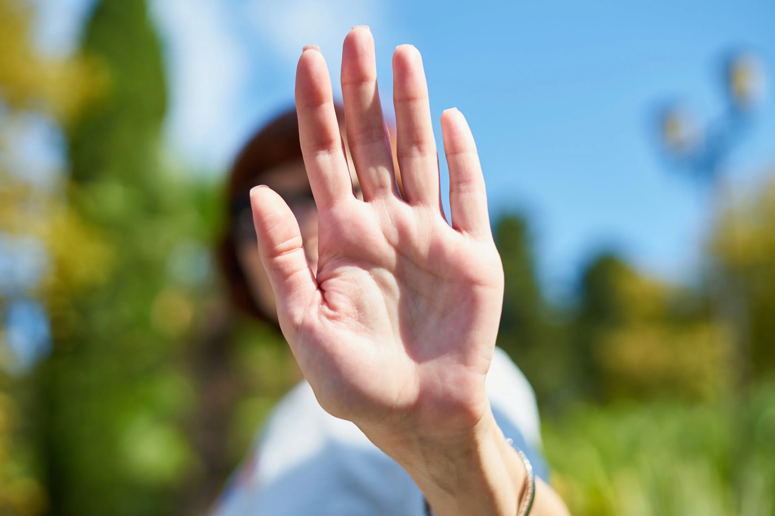 unrecognizable-woman-shielding-her-face-from-camera-selective-focus-concept-of-privacy-personal-space_t20_YwjNG1.jpg