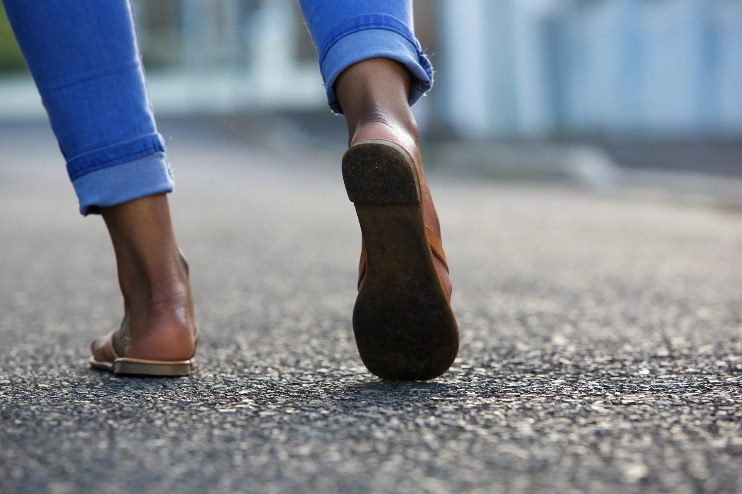 woman-walking-on-city-street-P9Q7LQN.jpg