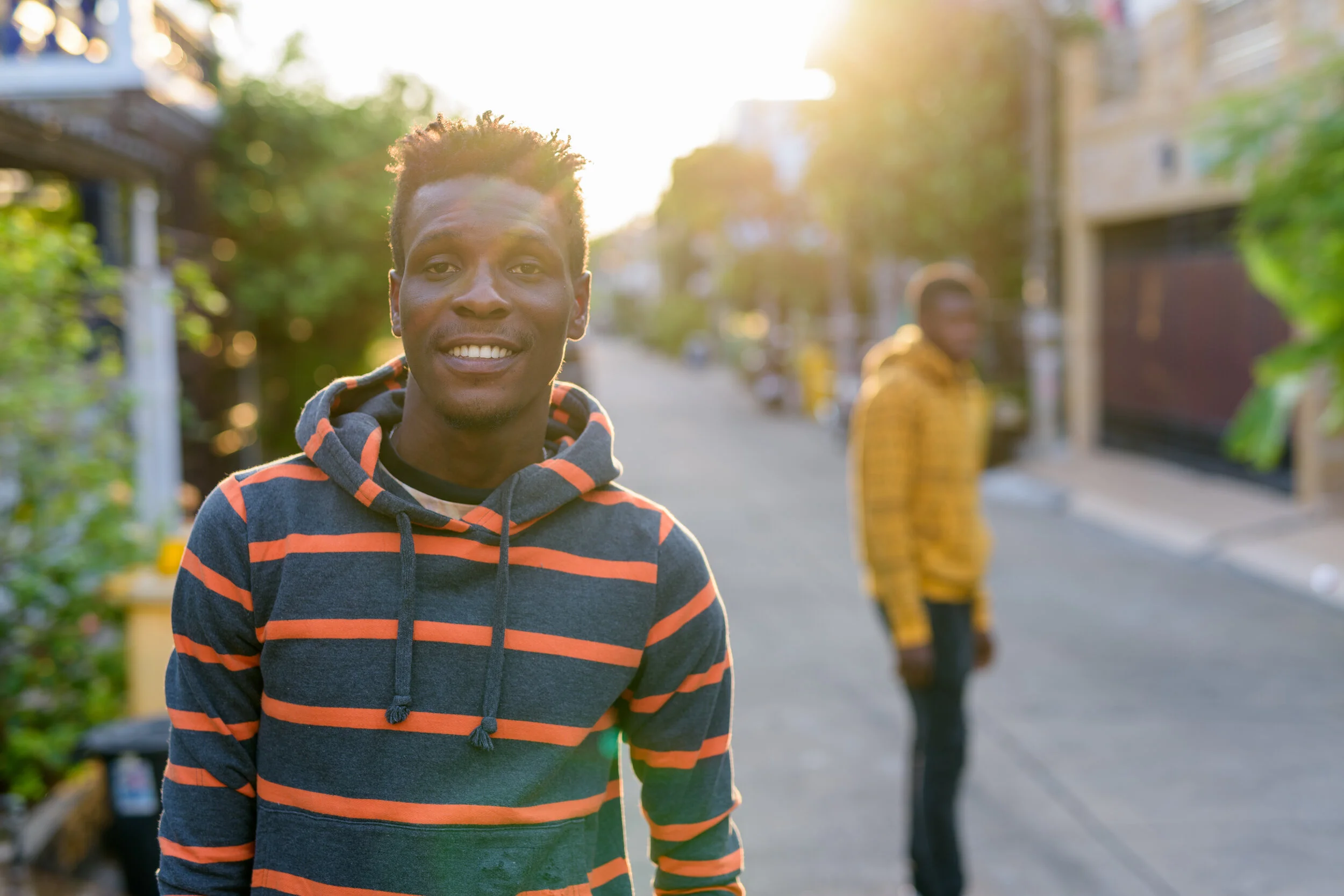 young-happy-slim-black-african-man-smiling-with-yo-MJZ9G2F (1).jpg
