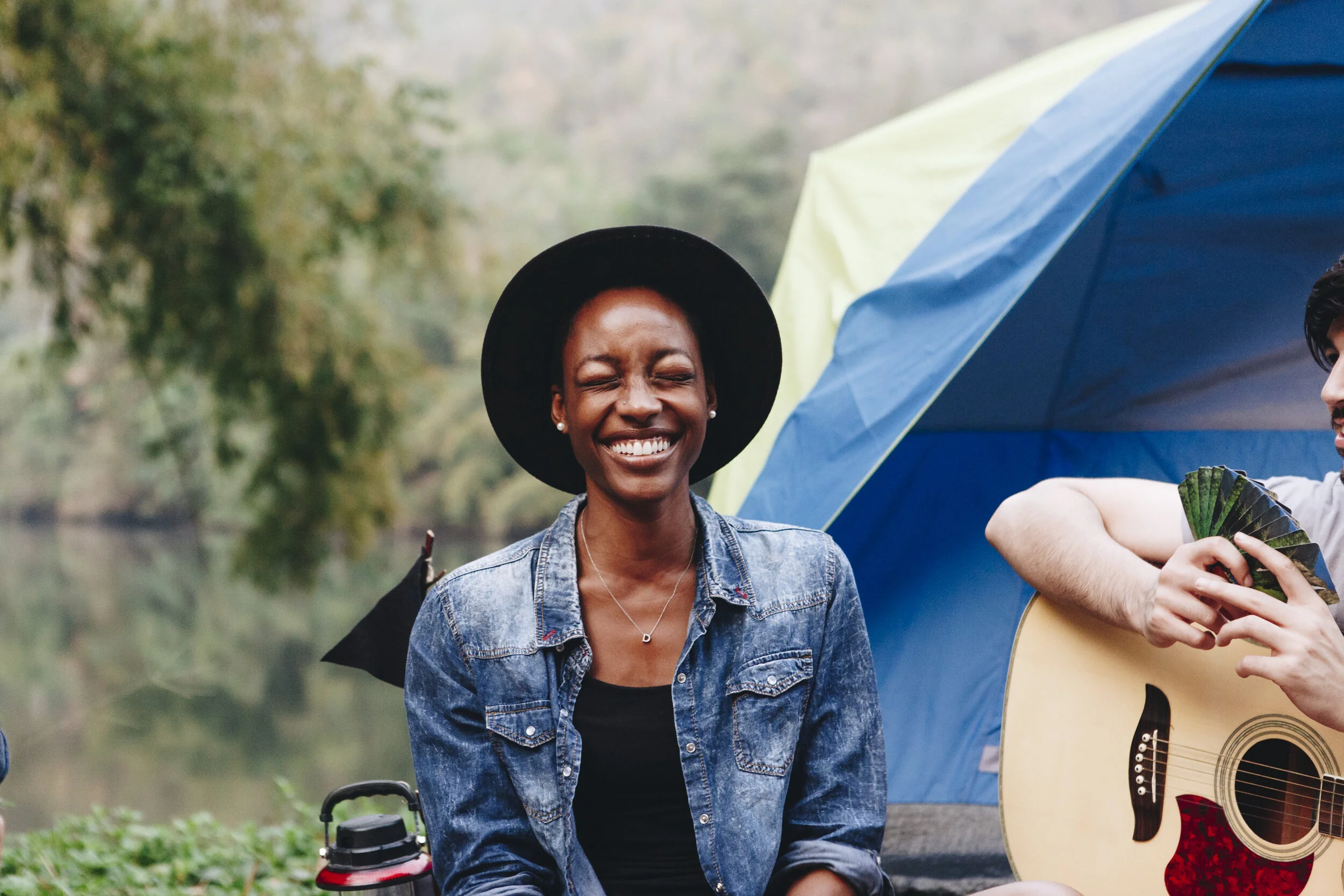 happy-woman-at-a-campsite-PJ7KG6M.jpg