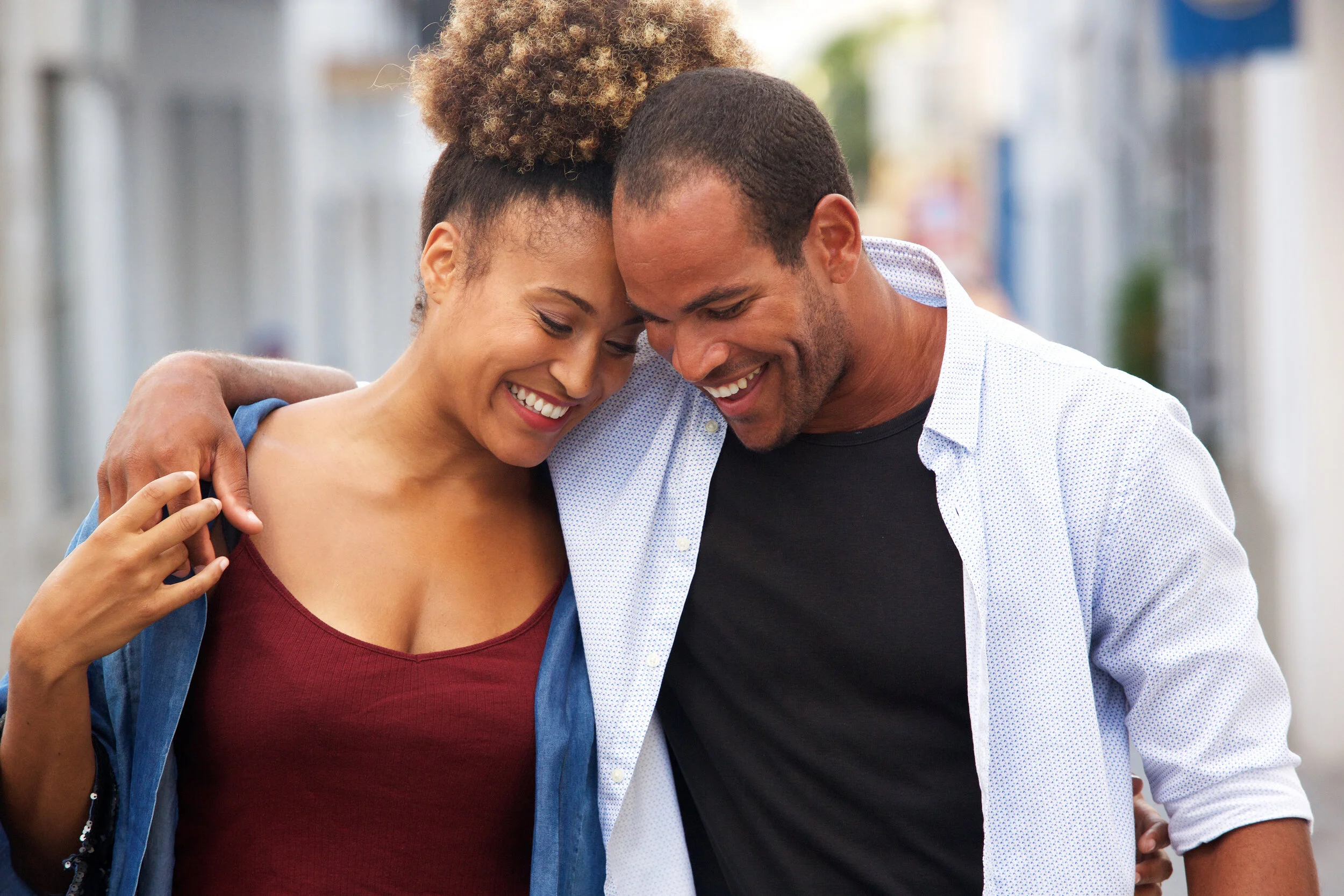 happy-couple-walking-together-in-embrace-on-date-SNVQF96.jpg