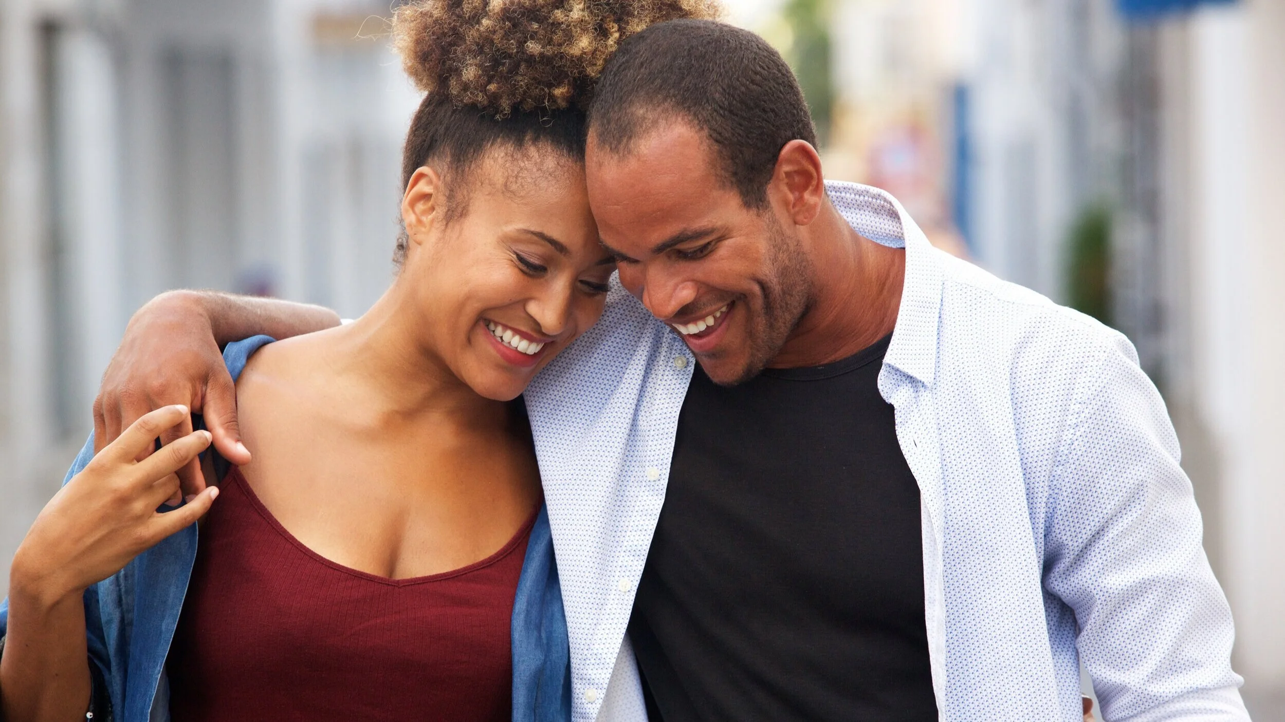 happy-couple-walking-together-in-embrace-on-date-SNVQF96.jpg