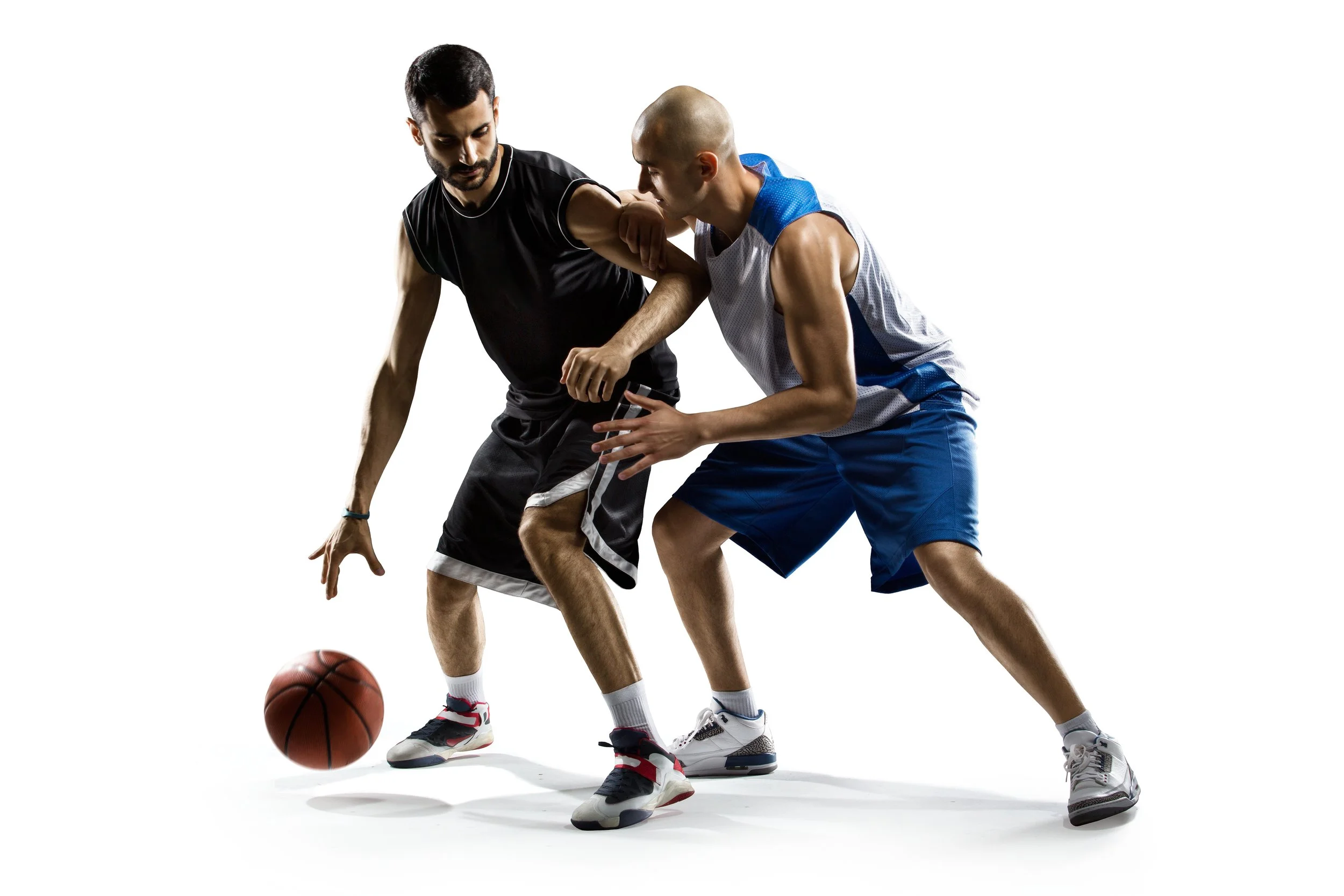 Two basketball players participating in a CLA (Constraints Led Approach) supported by an Ecological Dynamics framework.