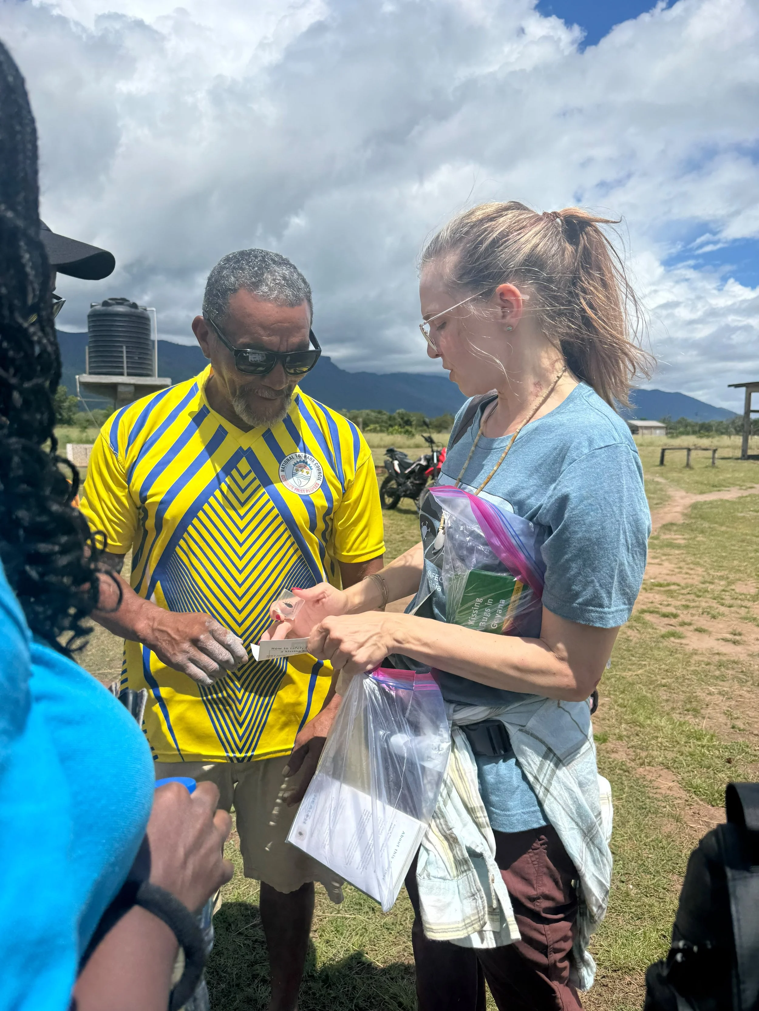 Showing examples of triatomine bugs to the village leader.