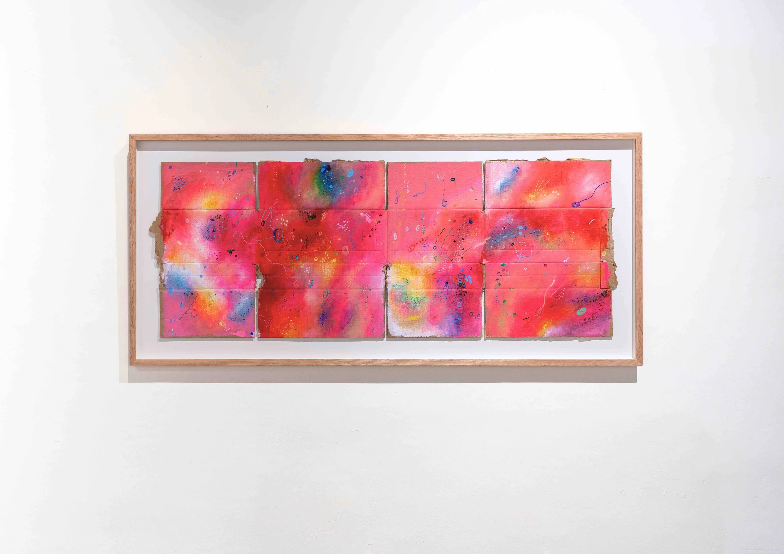 Abstract painting on recycled cardboard with vivid pink tones, fragmented surfaces and delicate graphic marks