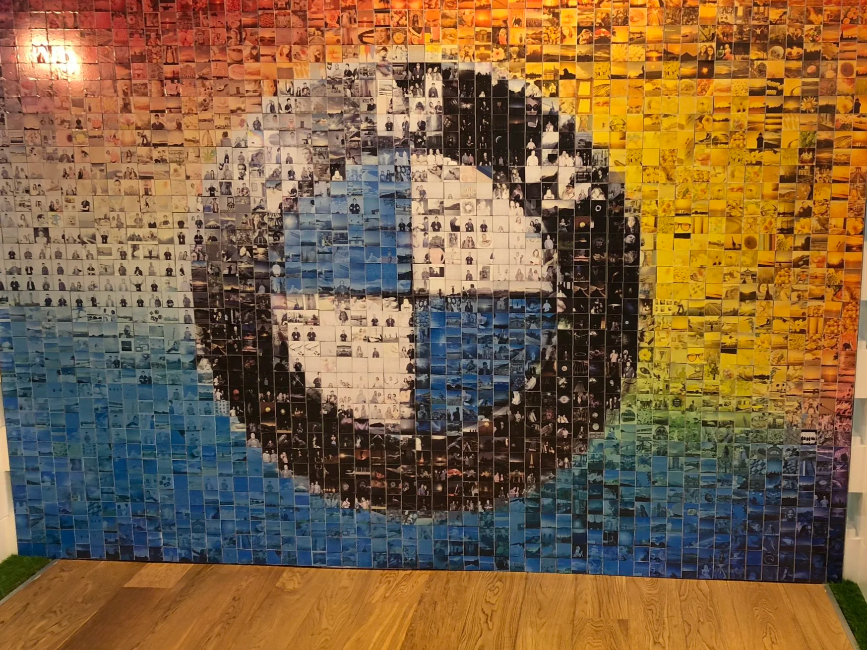 Photo Wall Mosaic, making up the BMW company logo at an event.