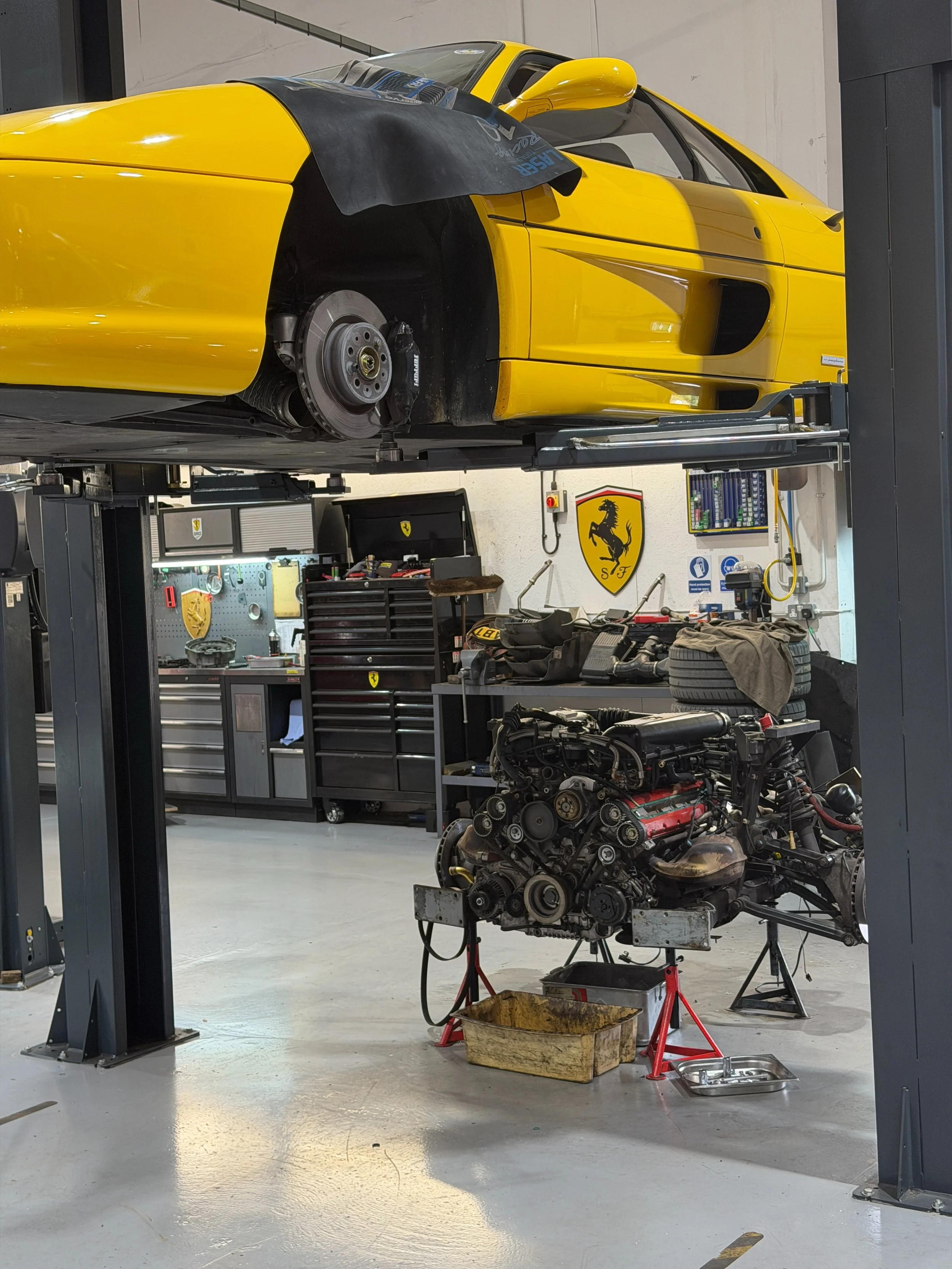 Yellow on the outside. Serious work underneath. 🐎

This Ferrari is currently with us for an engine-out cambelt service, with the old belts removed and new cambelts now being fitted.

It&rsquo;s a substantial job, but on these cars, proper maintenanc