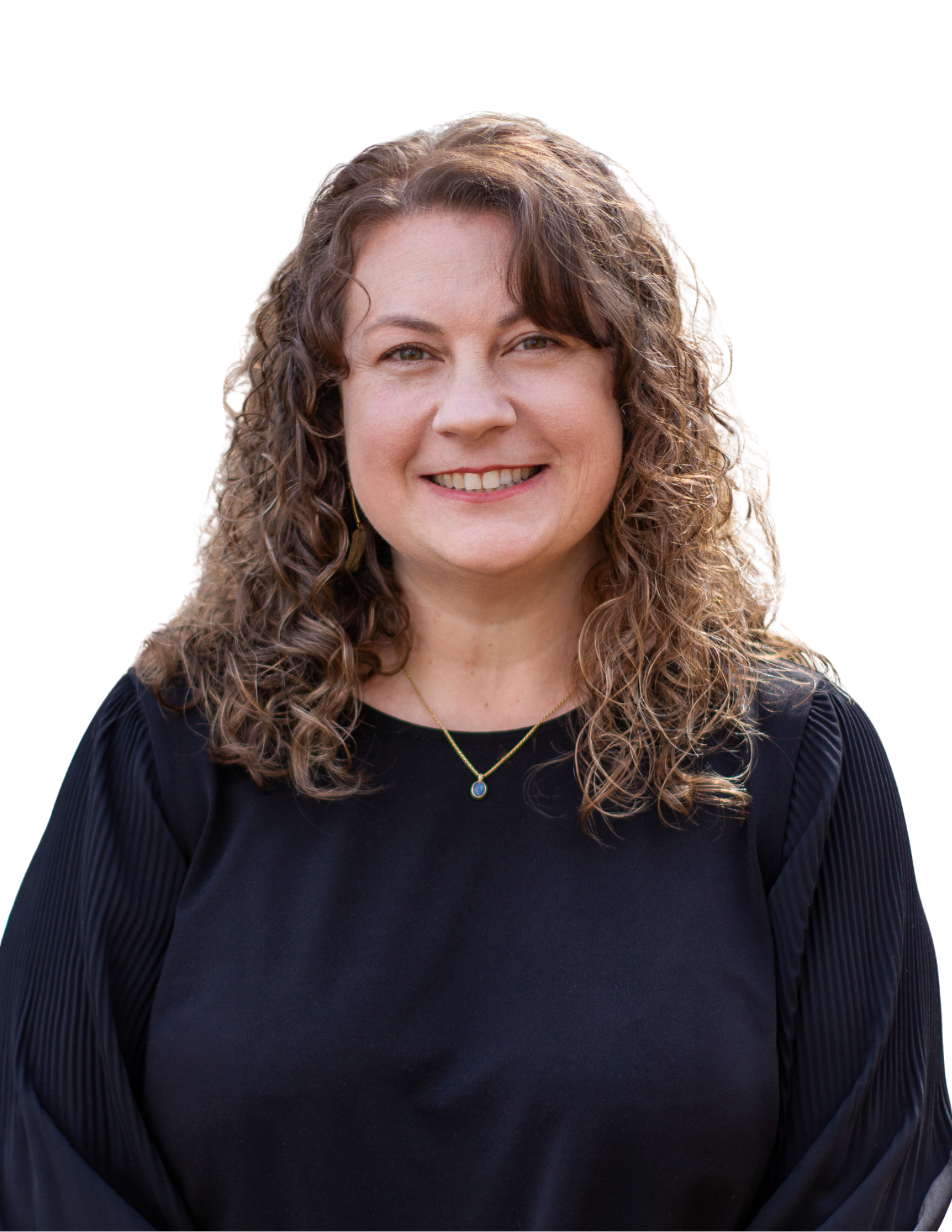 A woman with curly brown hair smiling, wearing a black top and a necklace with a small pendant.