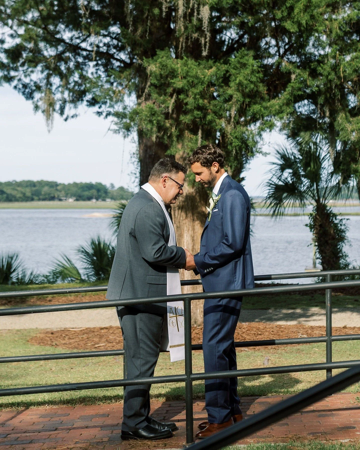 This is the quiet before the moment that matters.

A steady hand, a folded stole, two people taking a breath before everything else begins.
Calm doesn't happen by accident on a wedding day &mdash; it's built into the plan long before anyone notices i