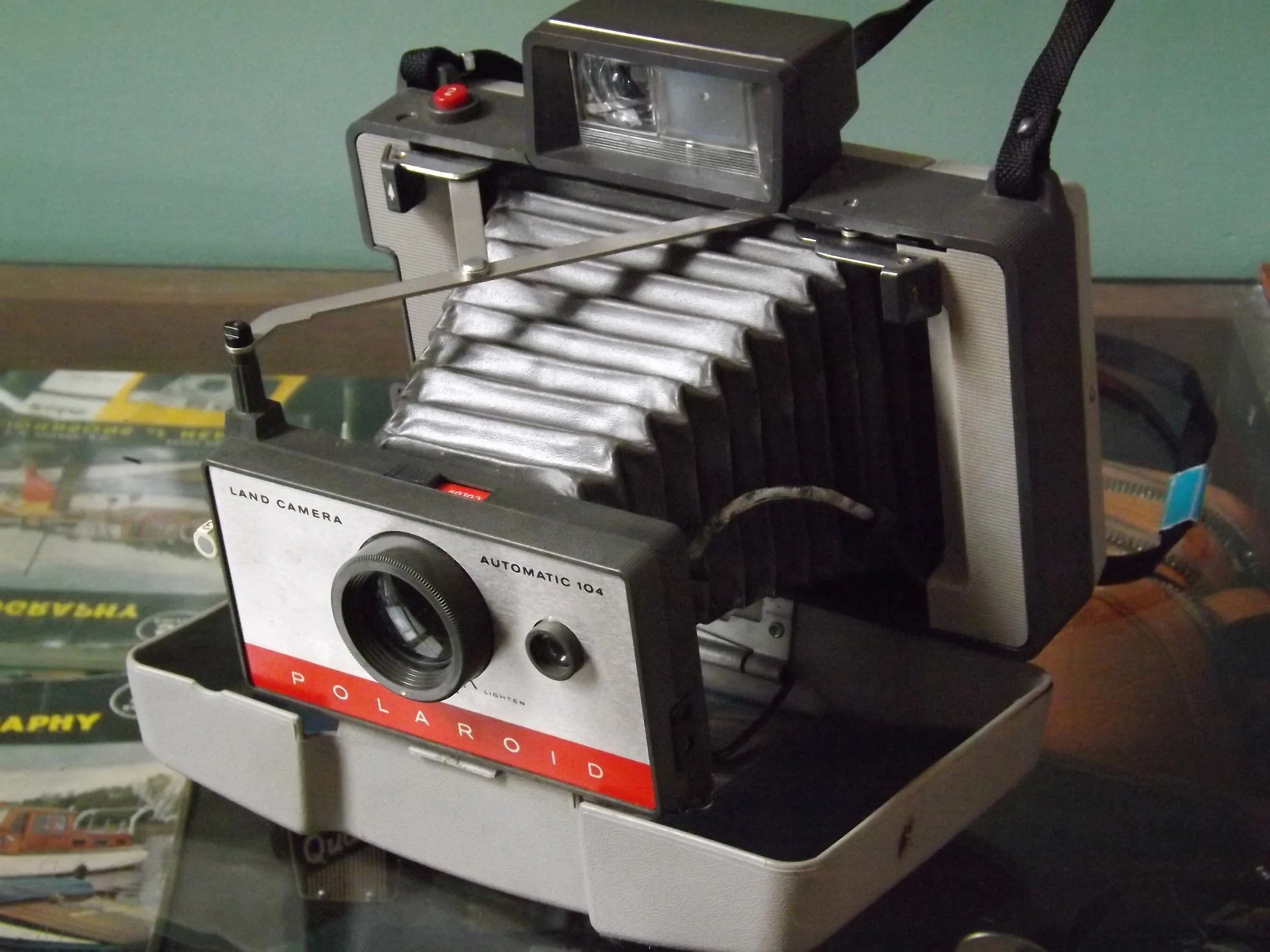 The Polaroid Automatic 104 Land Camera is a folding, bellows-style camera manufactured between 1965 and 1967.