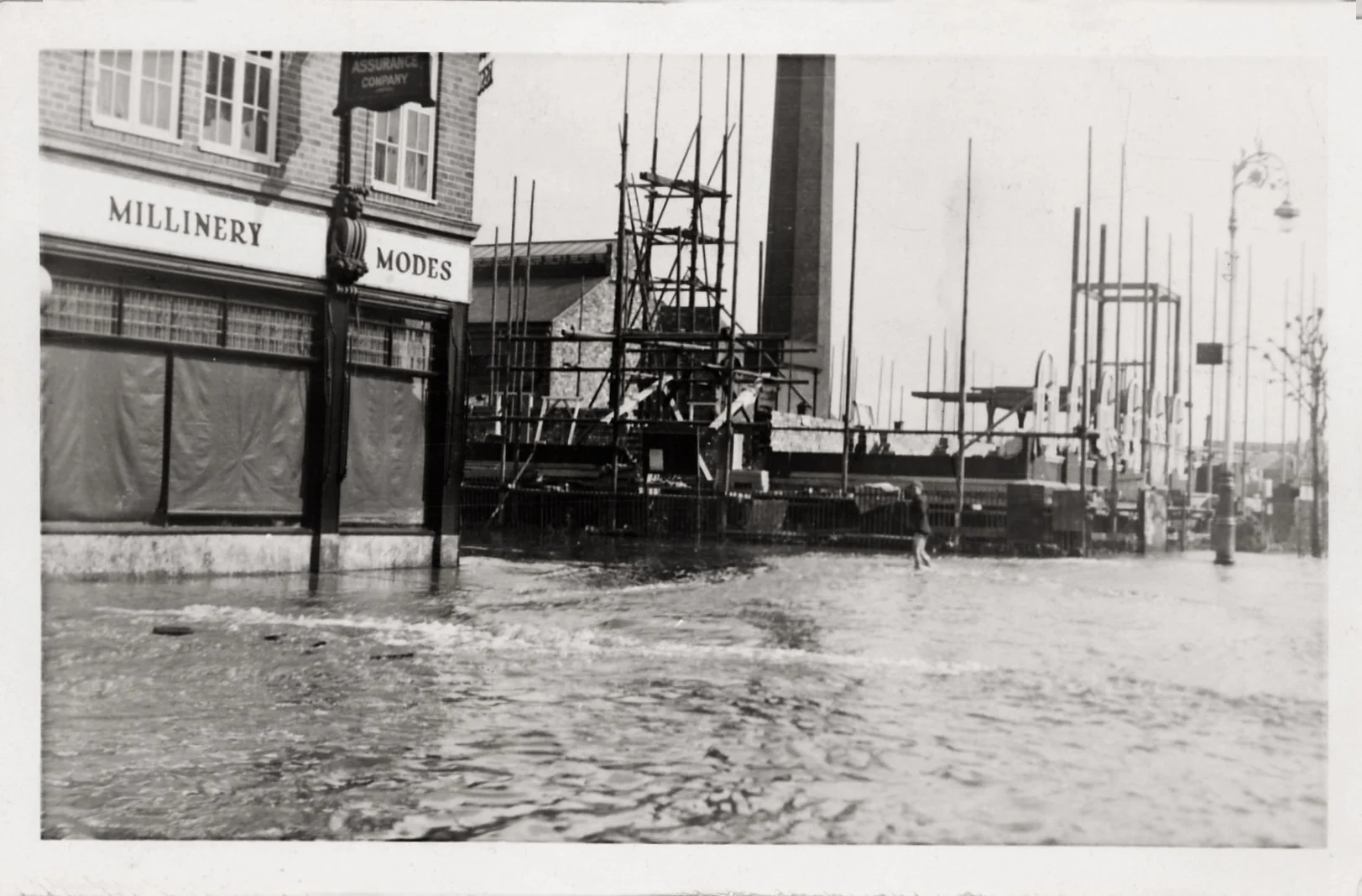 The Town Hall under construction in May 1932 when the River Anker and the Wash Brook flooded. The footings were completely washed away and the build had to be started again, delaying the opening until 1934. Milliner's became The Tool Box and is now c