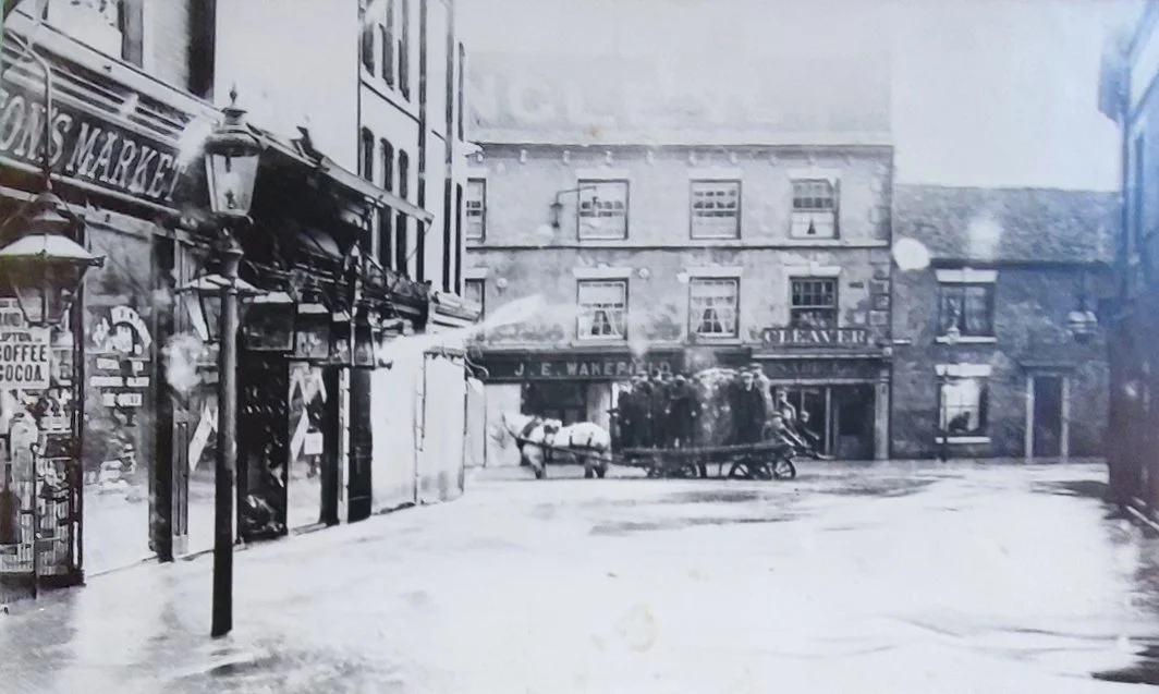 Bridge Street in the 1932 floods.  J C Smiths is yet to be built.  Bridge Street has not yet been widened.  The buildings at the bottom will become J C Smiths furniture warehouse and after being demolished will then become  Sainsburys and then Wilkin
