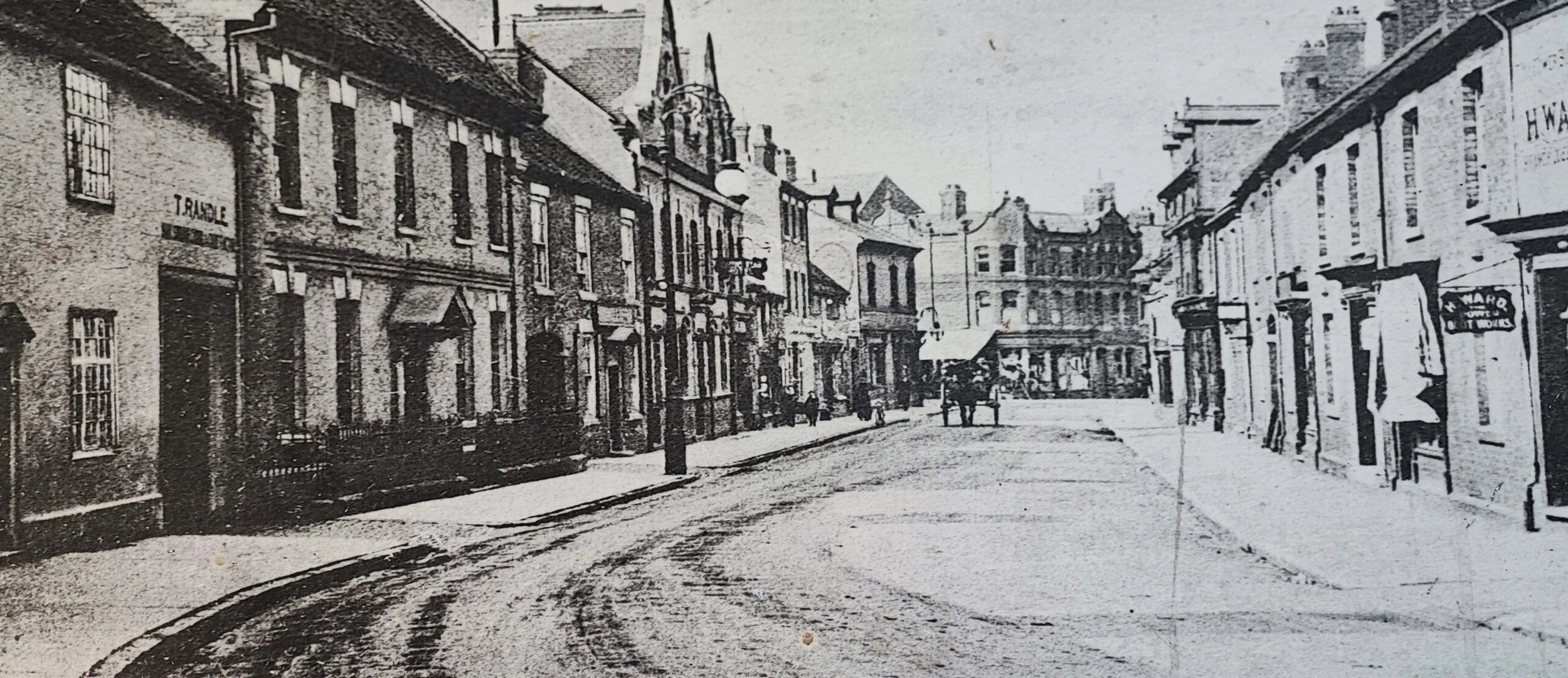 An old photo of Church Street Nuneaton.  Probably taken late 1800's or early in the 20th century. Bridge Street is at the bottom off the picture. The building with the two pointed gables is the old Pen and Wig. The house next to Randles in the left f
