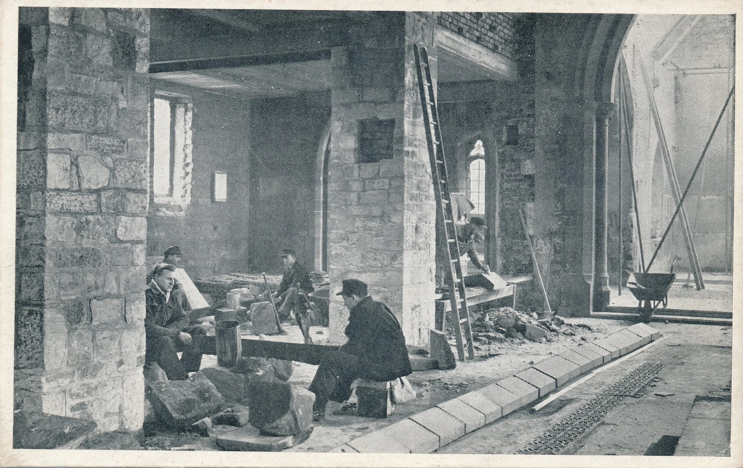 German Prisoners of War help local craftsmen in the rebuilding of Coton Parish Church in 1946.