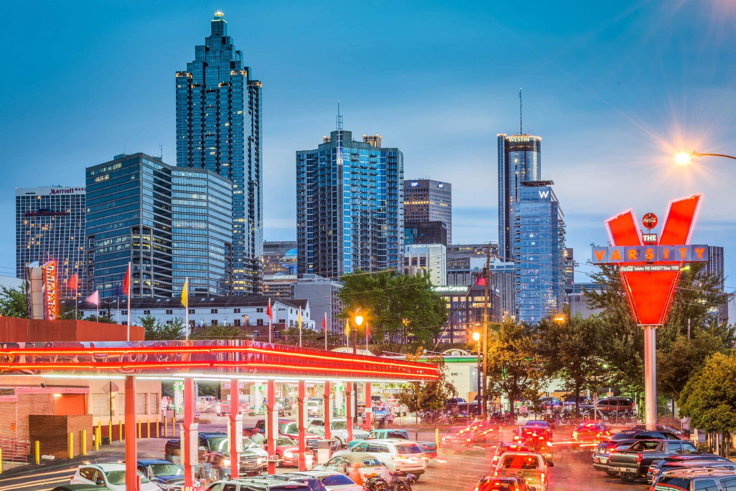 Atlanta Georgia skyline at dusk with The Varsity restaurant in the foreground