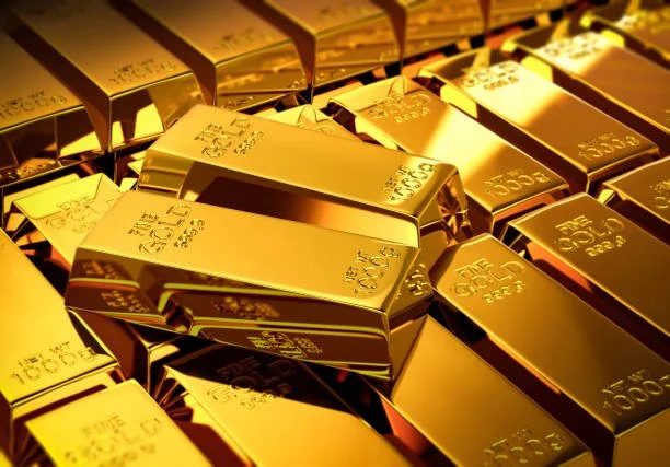 A pile of gold bars stacked together.