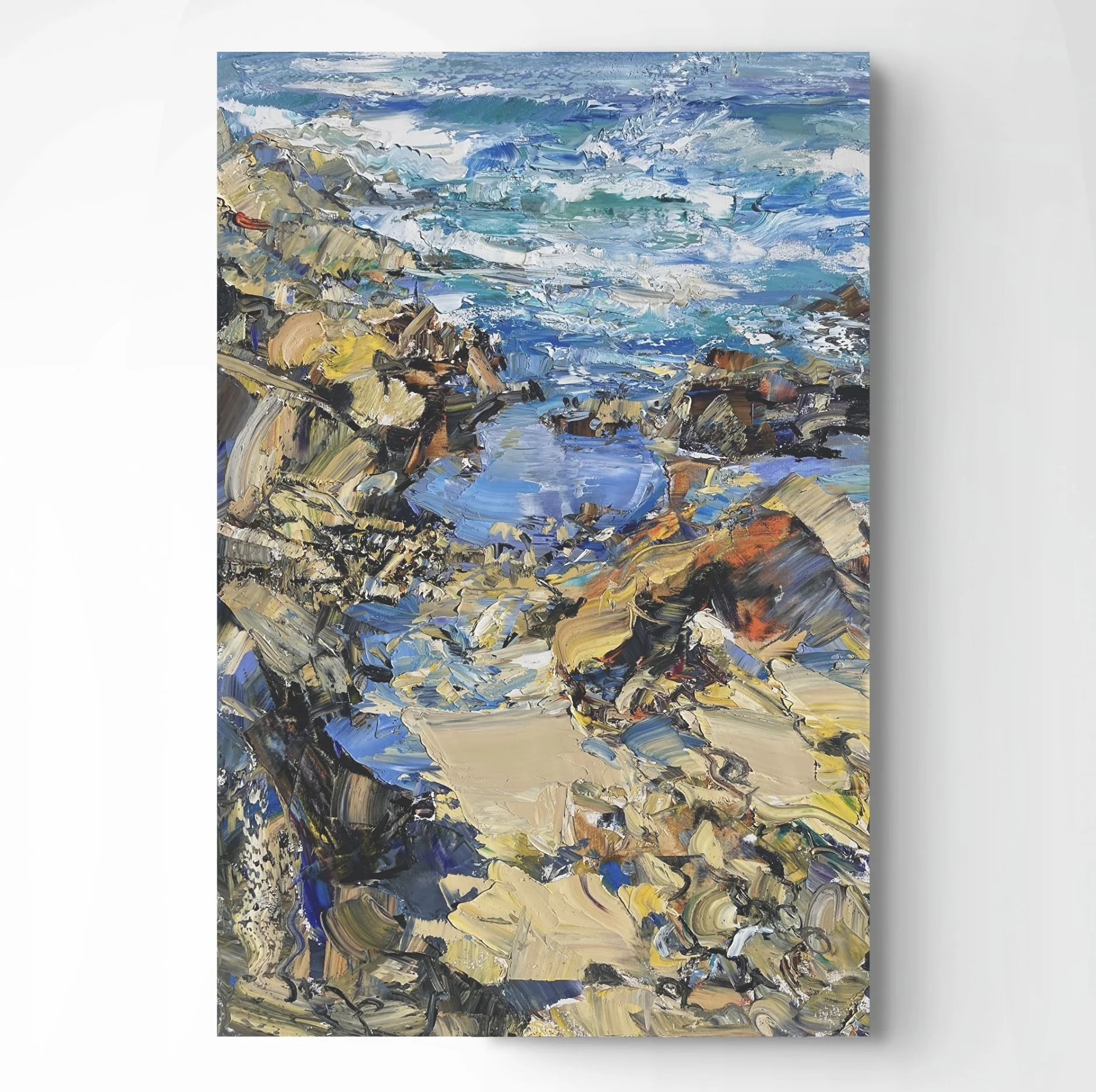 Abstract landscape painting depicting a shoreline with rocks and a body of water, using thick, textured brushstrokes in shades of blue, beige, black, and hints of red and yellow.