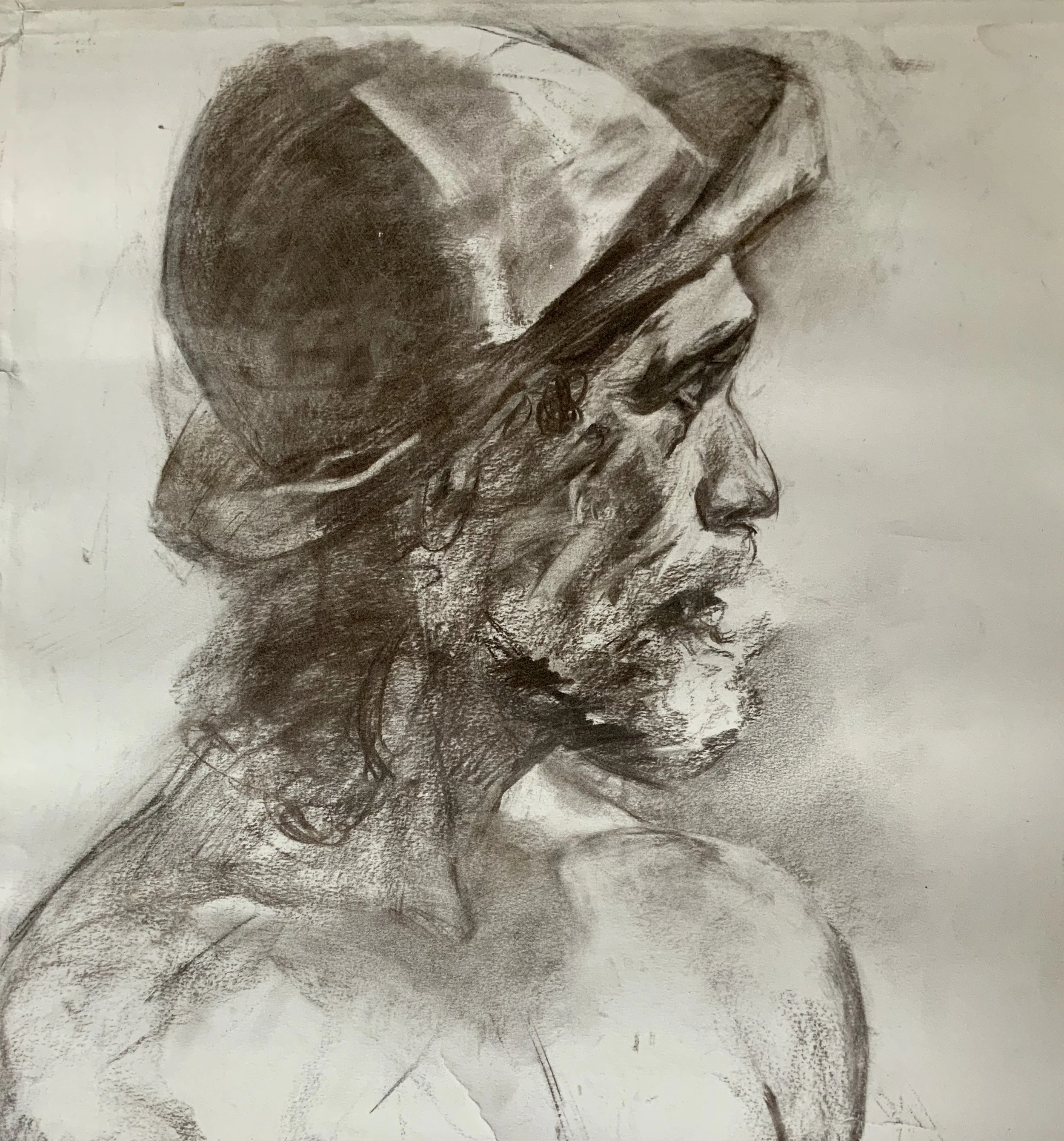 A black and white sketch of a person in profile, wearing a head covering, with various shading and contour lines highlighting facial features and hair.