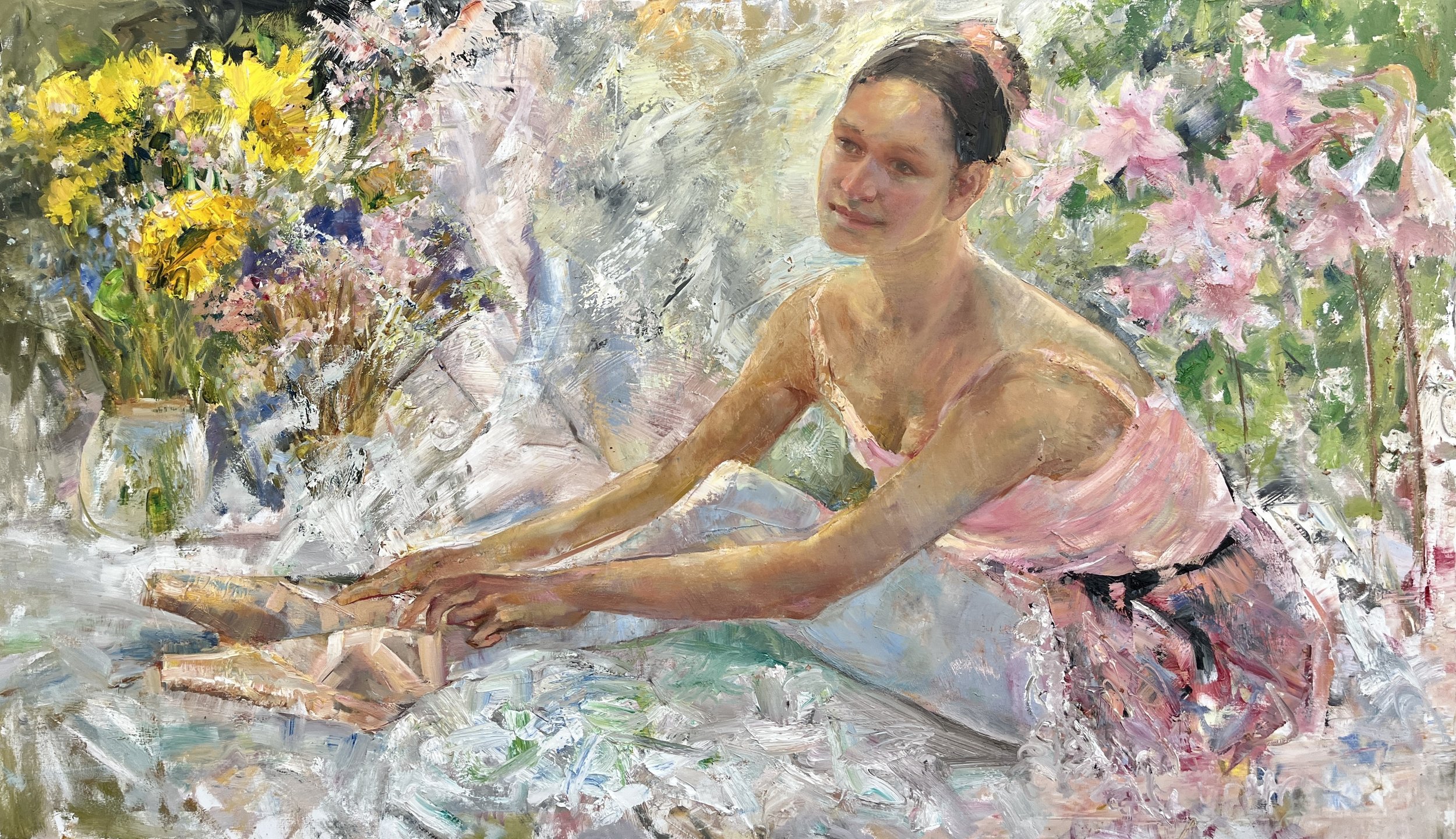 An oil painting of a woman with dark hair sitting among colorful flowers. She wears a pink dress and has her arms extended on a surface, with a gentle expression on her face.
