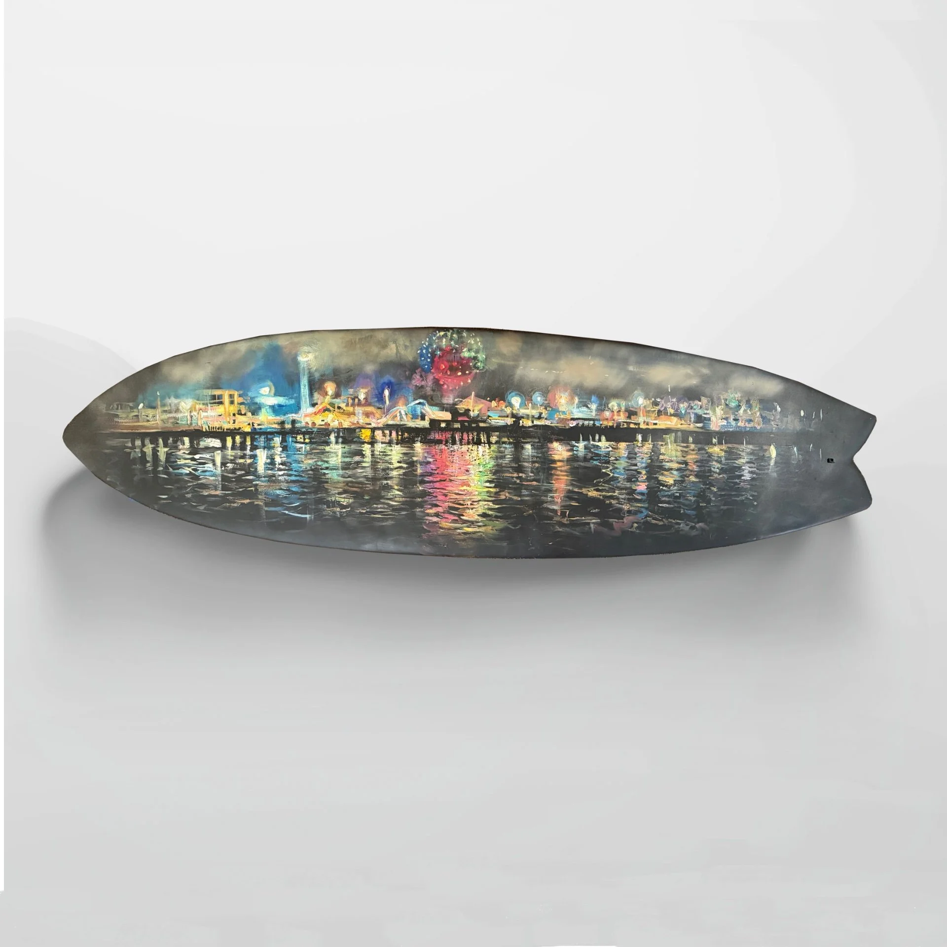 A nighttime cityscape reflected in water, with colorful lights and structures including a ferris wheel.