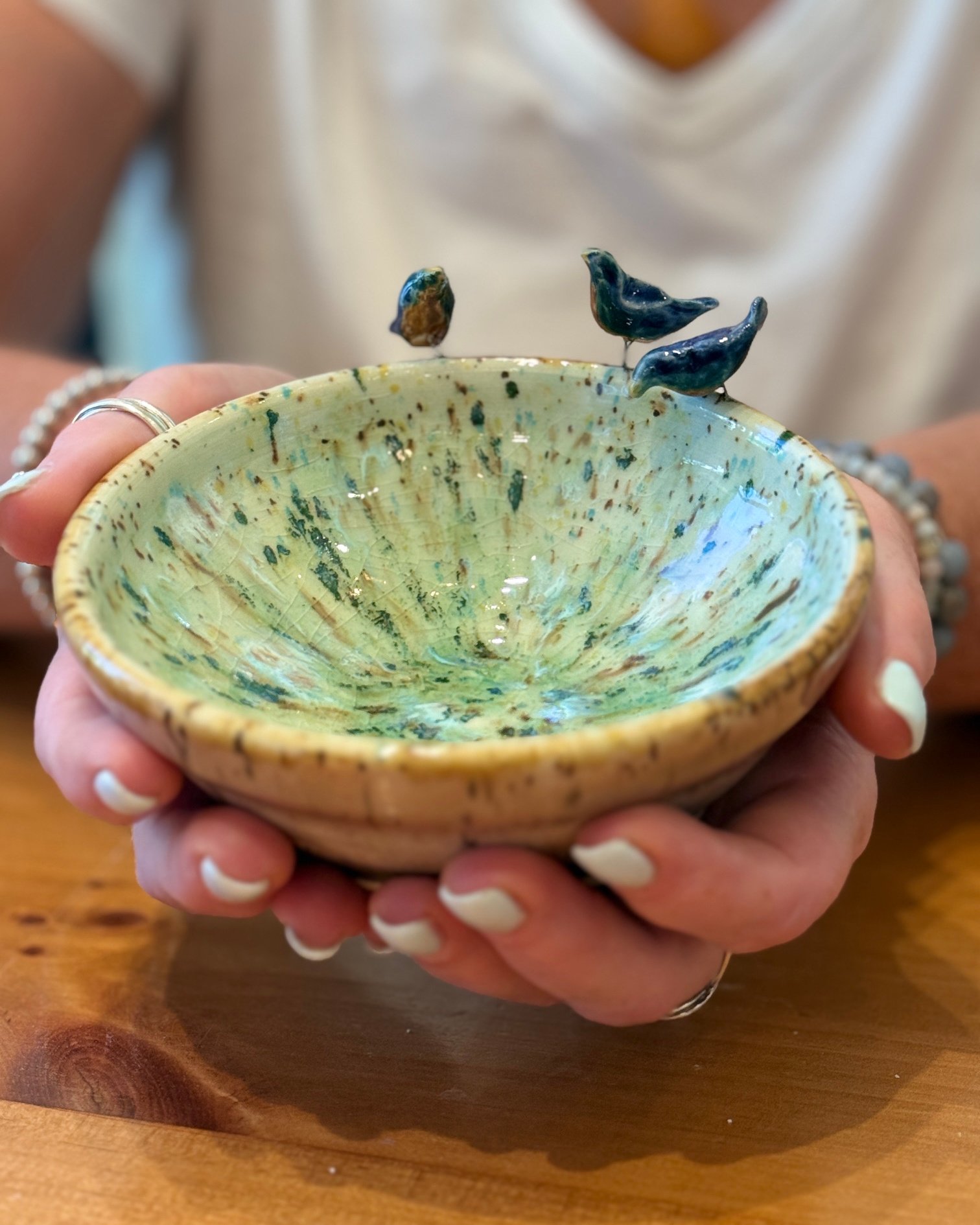 Three Bluebirds on a Dish