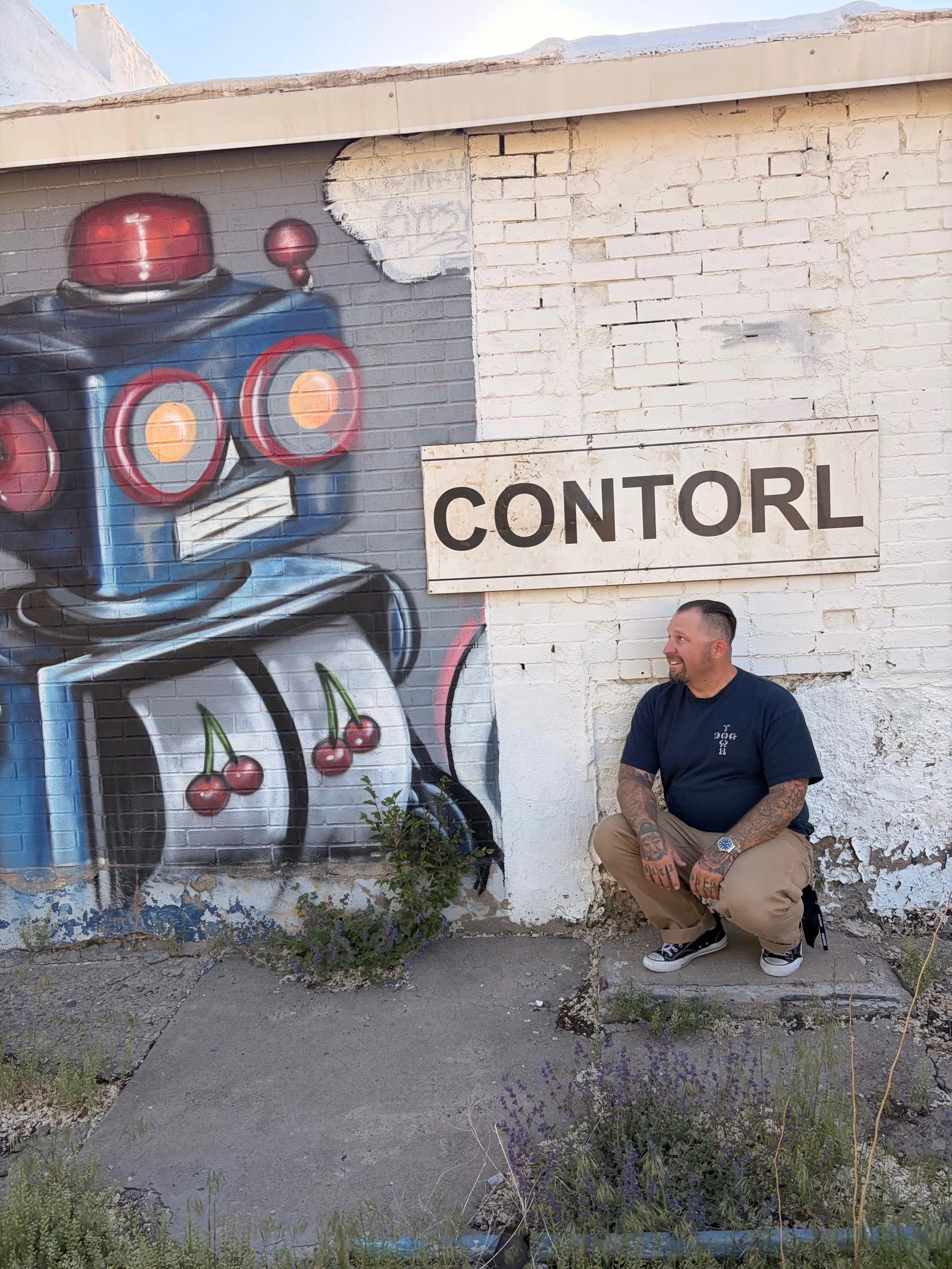 Dave Smith in front of street art piece