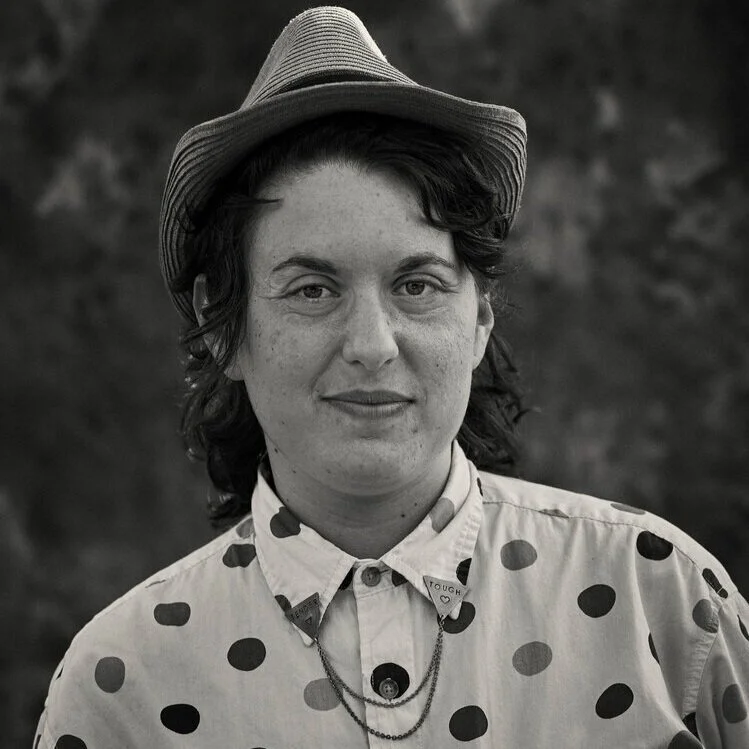 A black and white headshot photo of Margot