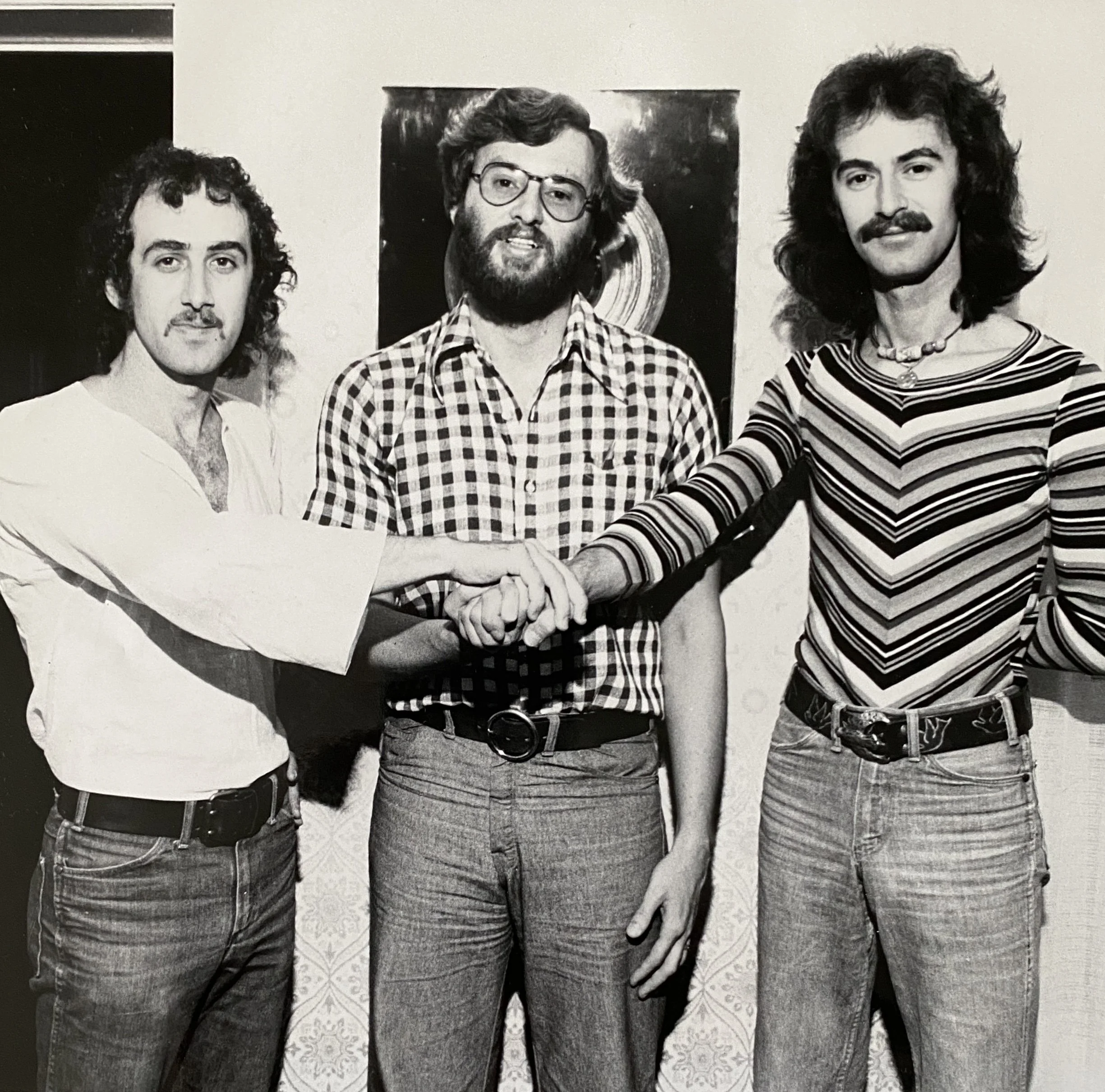 Tony Tobias, Al Mair, Ken Tobias. Signing of Ken To Attic Records, Toronto. 1974.