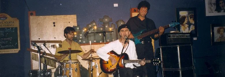Rob Poizner, Ken, Paul Kobayashi - Book of Tobias Trio, at Free Times Cafe, Toronto 1998. Photo: Moe Lieff.