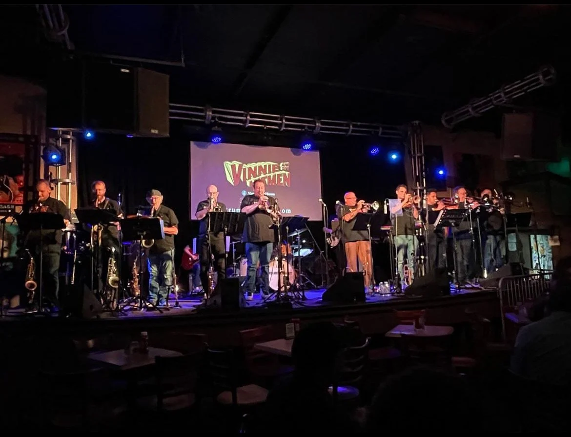Scott performing bass trombone with Vinnie and the Hitmen