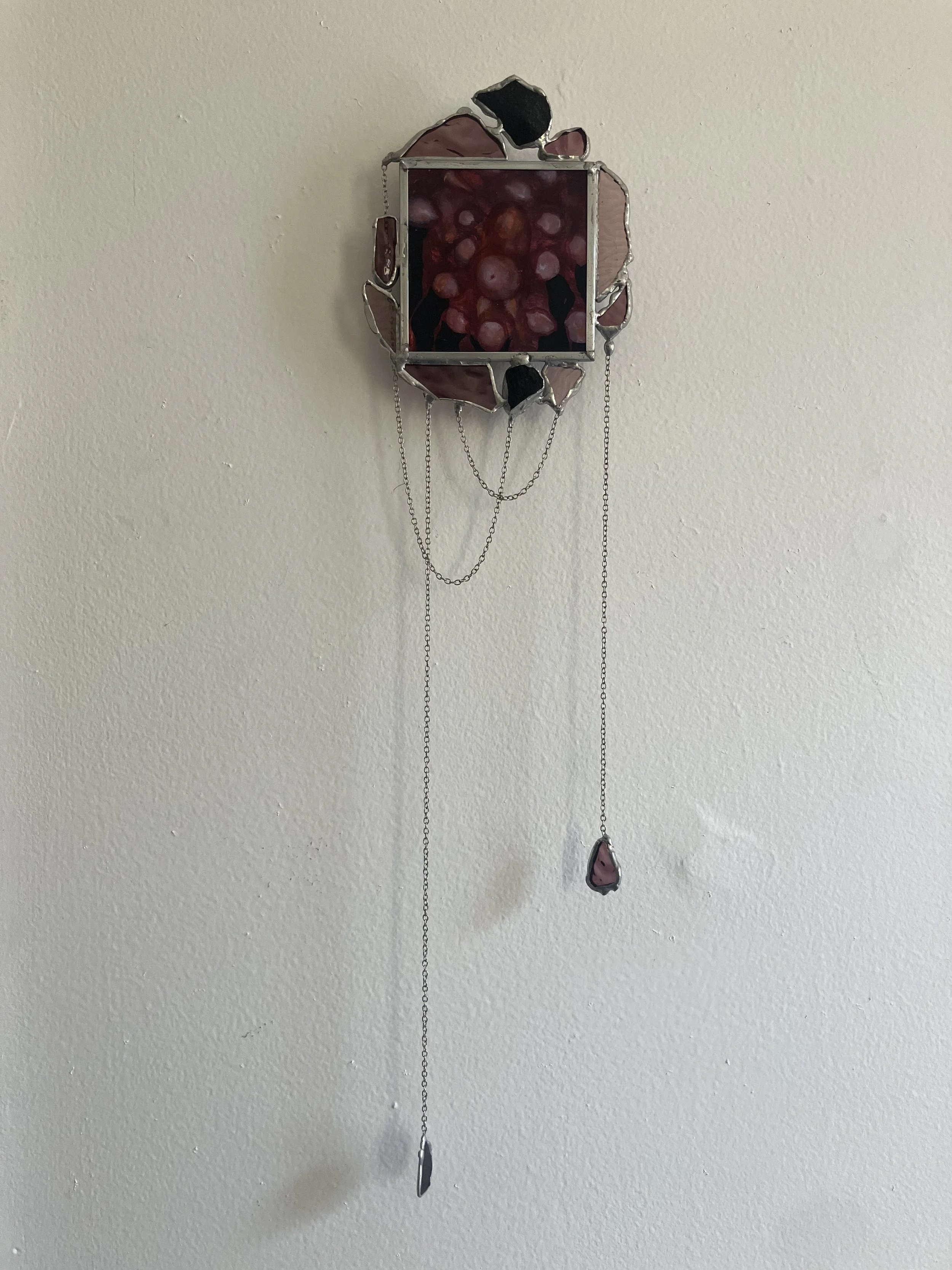 They're all watching, 2026, Oil on matte board, stones, glass, chain, solder, copper foil, wire, zinc came, 20.5" x 5" x 1"
