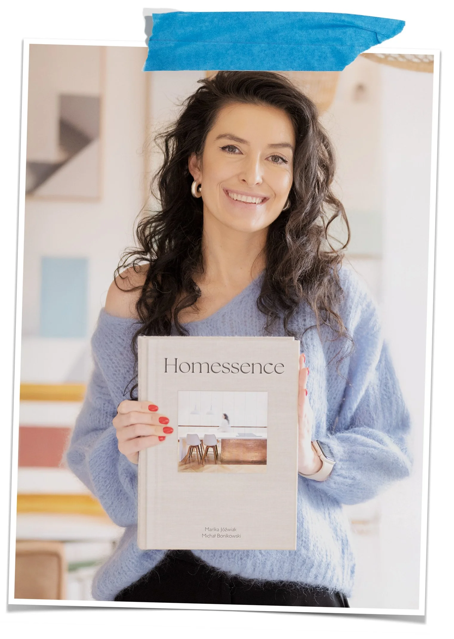 Person holding a book titled 'Homessence' with a home interior photo on the cover. Marika Jozwiak