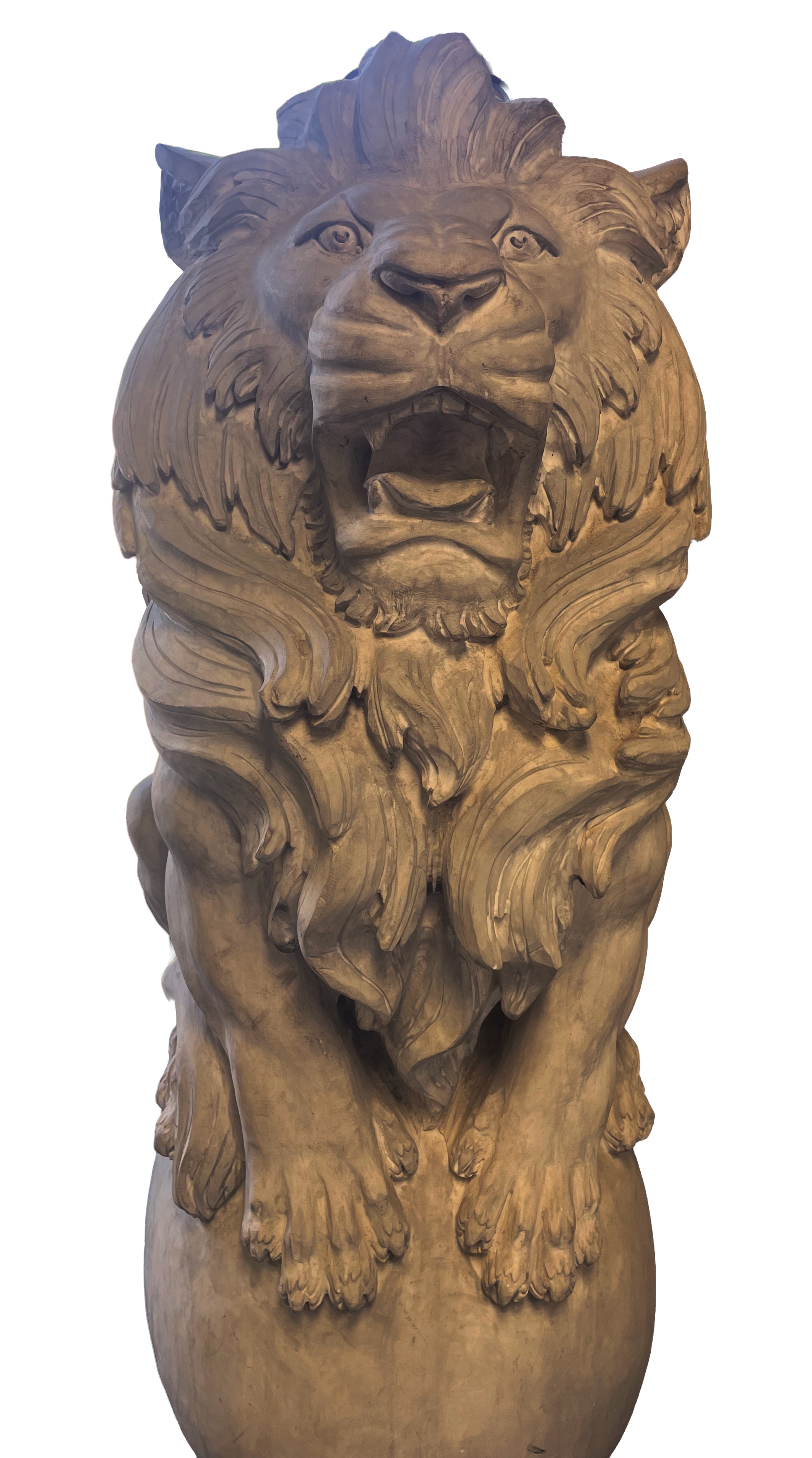 Wooden sculpture of a lion with a detailed mane, open mouth, and expressive eyes, standing on a large vase-shaped base.