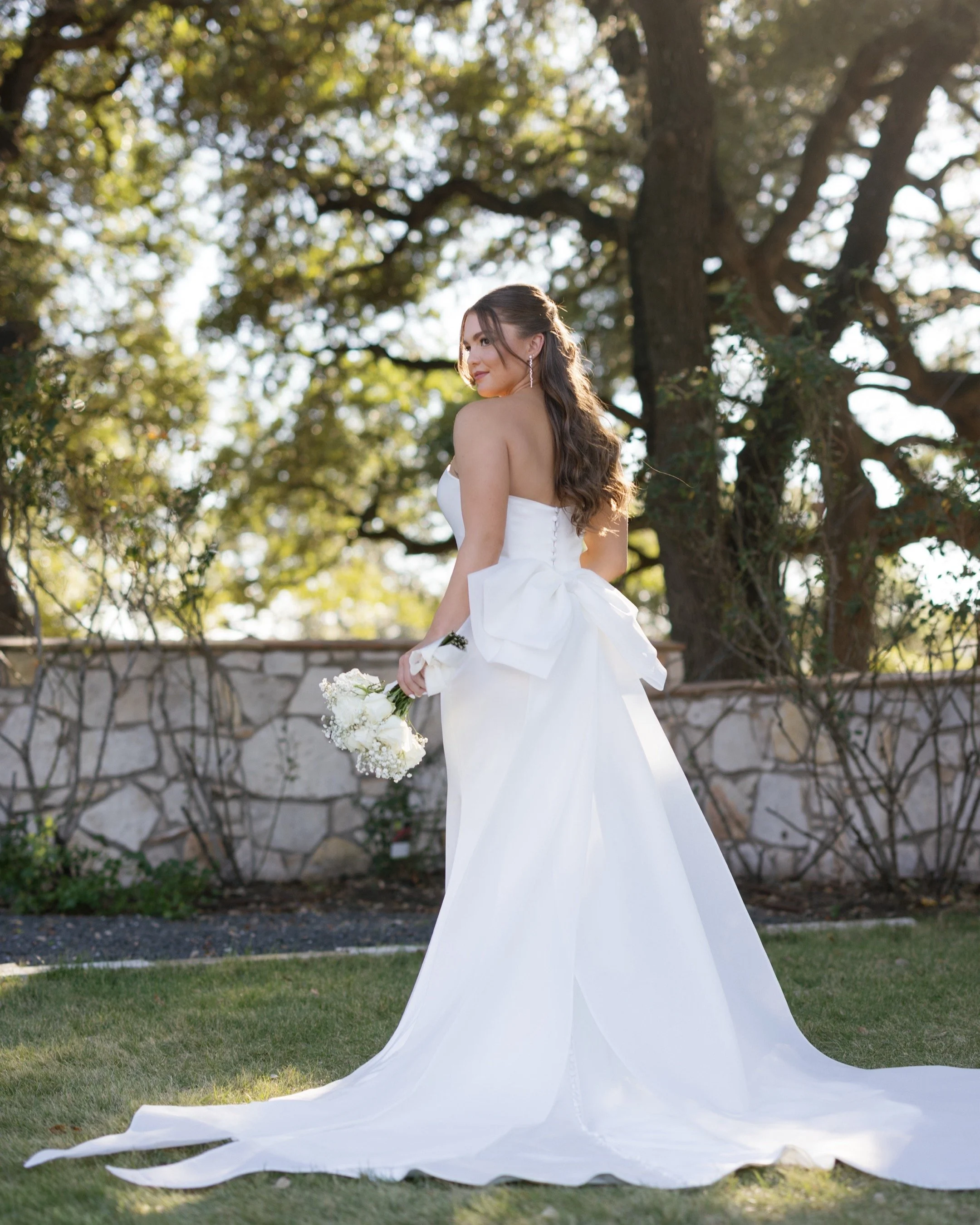Bridal Glow experience by Aurenza Studio, formerly Caramel Tan, featuring radiant, photo-ready skin and custom wedding spray tanning.