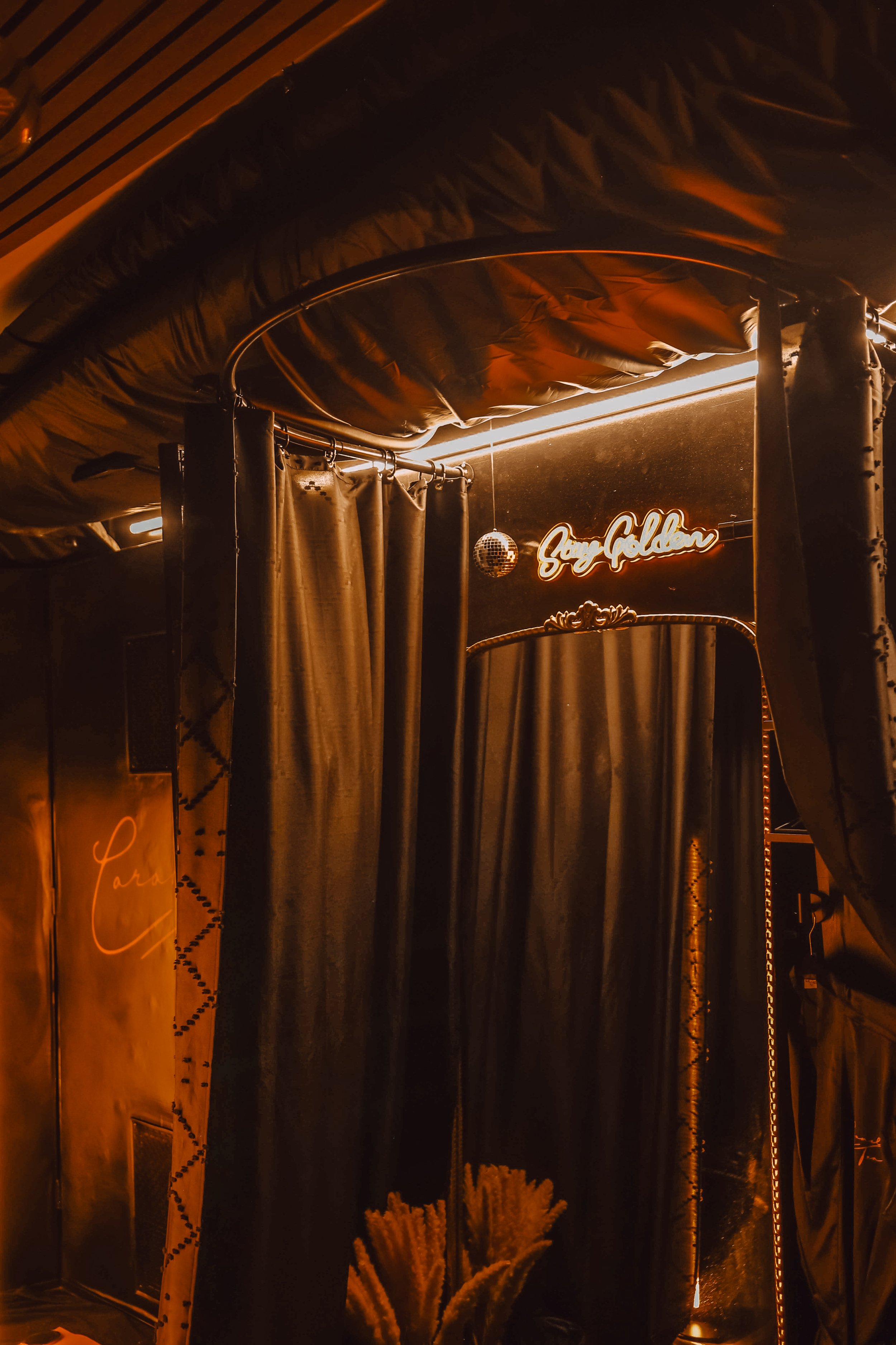 Private changing area inside the Caramel Tan Wellness Studio with clean, minimalist decor designed for a calm, comfortable pre-tan experience.