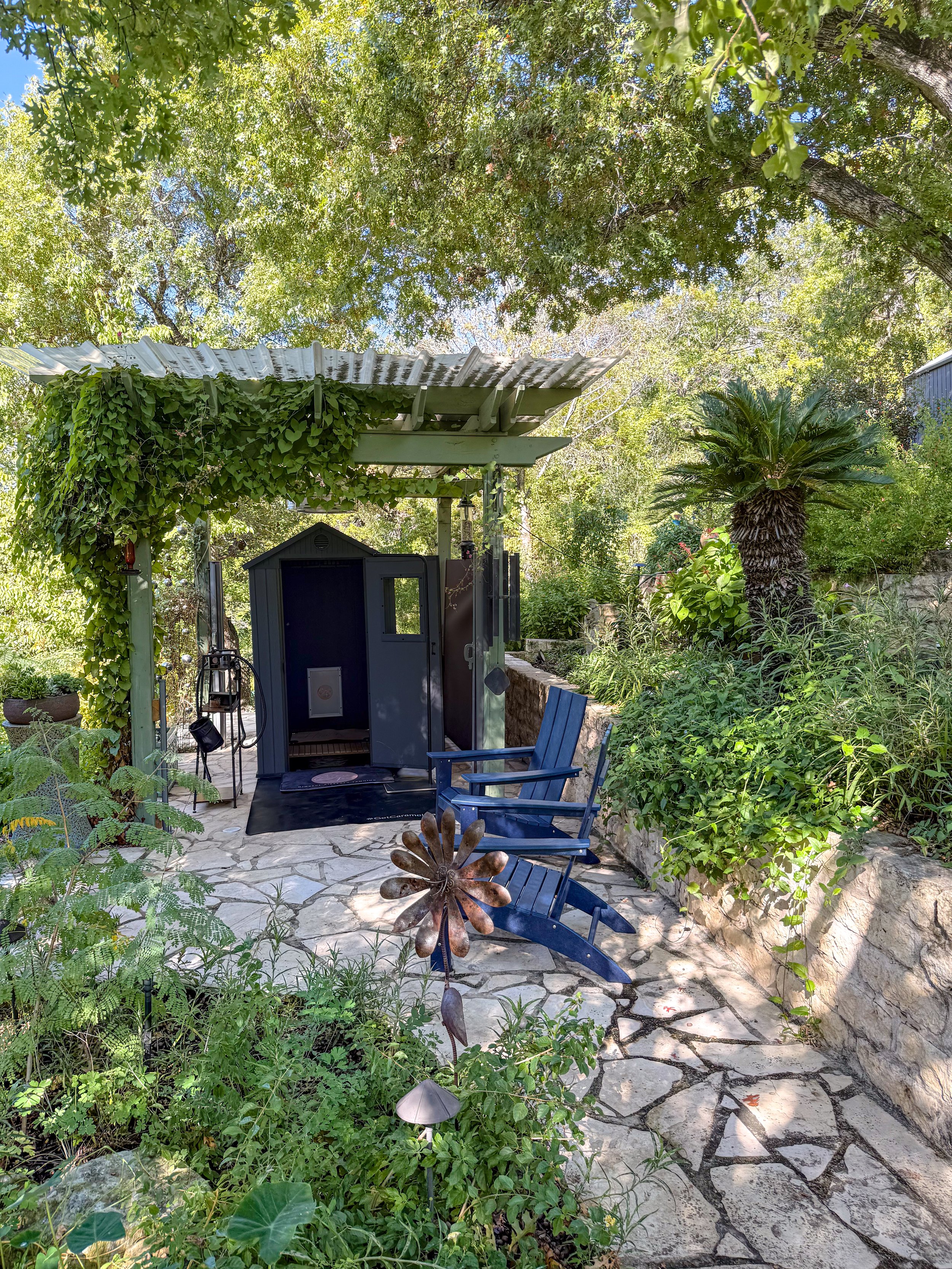 Open-air spray tan space at the Caramel Tan Garden Studio in West Lake Hills, featuring natural light, fresh air, and the serene outdoor tanning environment.