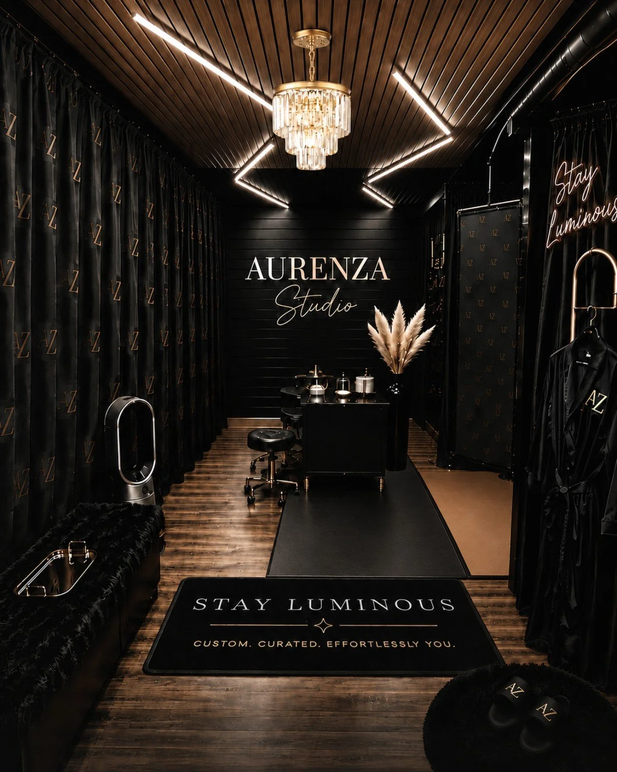 Luxury Aurenza Studio interior in Austin, Texas featuring an elegant private spray tanning studio with modern black decor.
