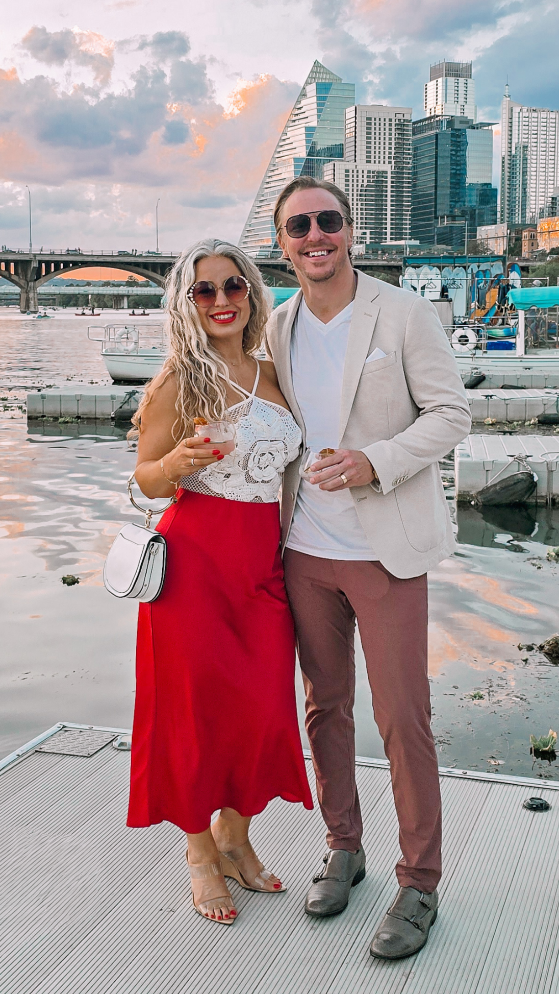 Amy, founder of Aurenza Studio, and her husband showcasing natural-looking custom airbrush spray tans in Austin, Texas.