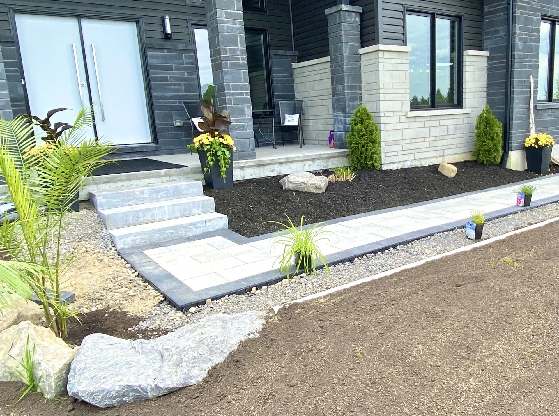 Front entrance with concrete steps and interlock walkway in Ottawa