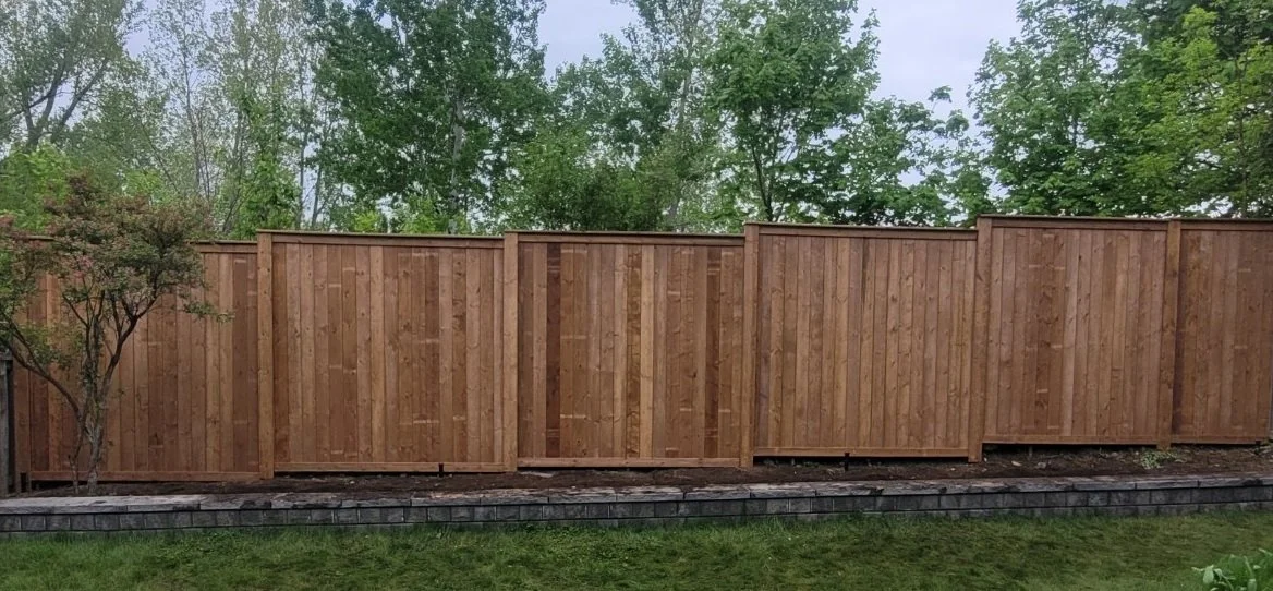 Wood privacy fence installation in Ottawa backyard
