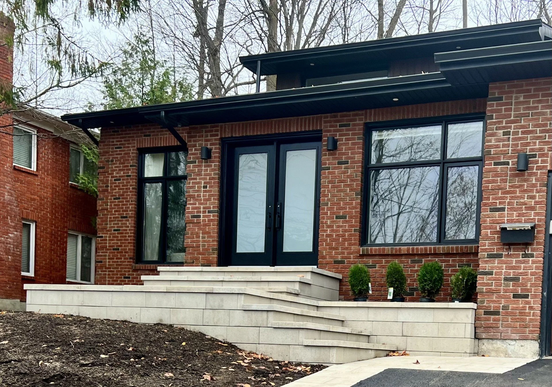 Front entrance transformation with steps and garden bed in Ottawa