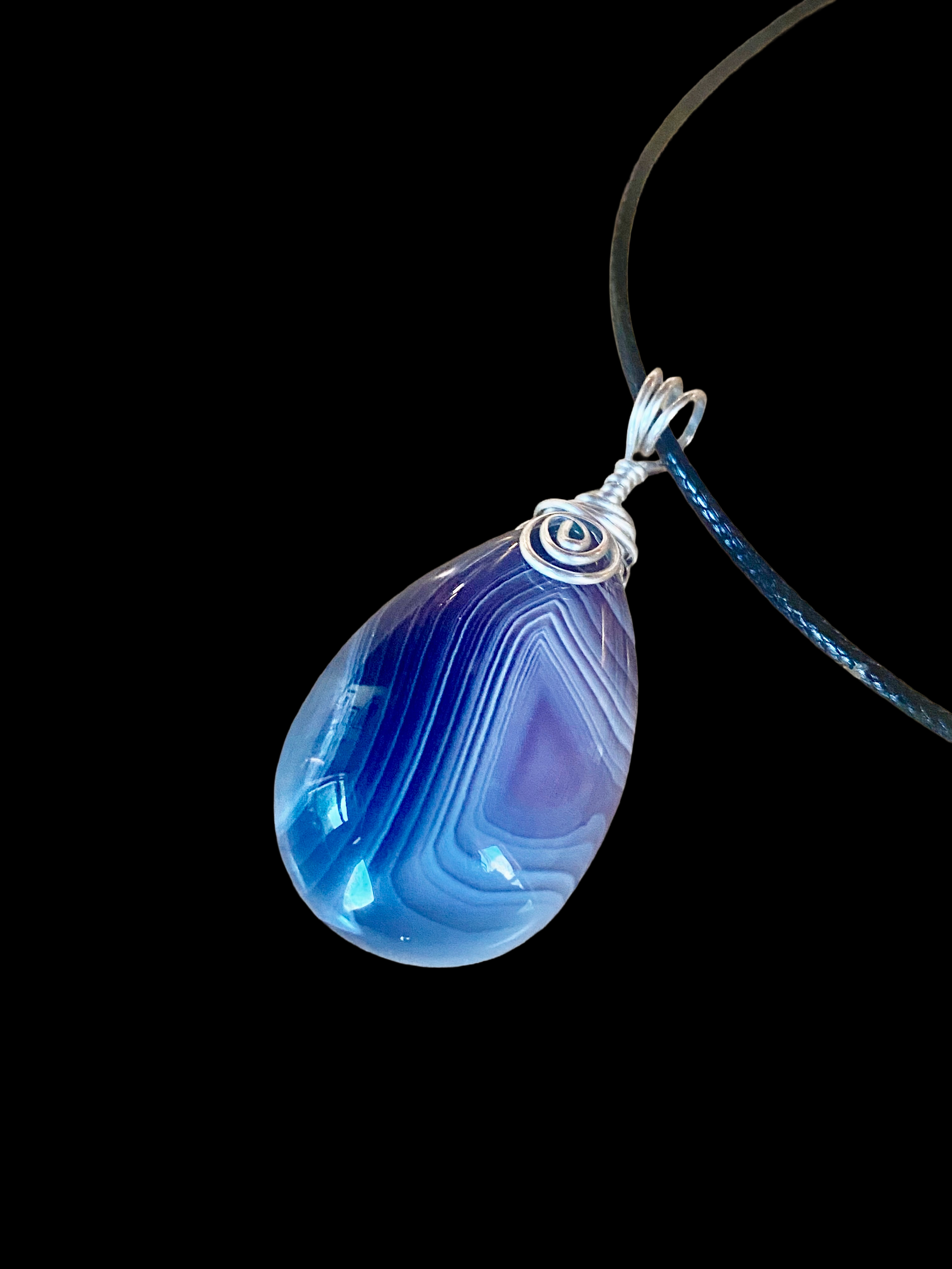 Blue Pendant on a Black Cord Necklace