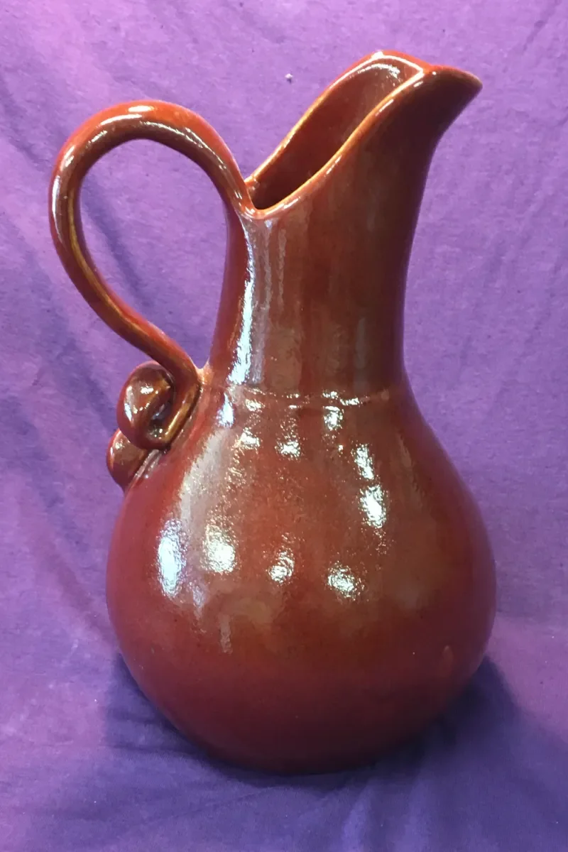 Pitcher/Vasee Decorative Pottery. Thrown on whee, handmade handel, glazed, cone 10 and kiln fired