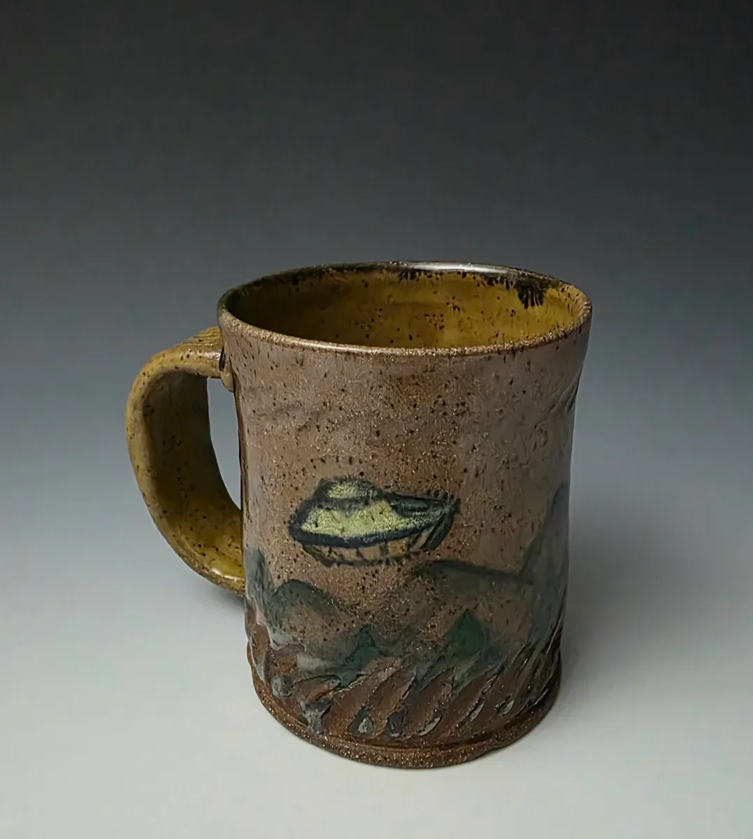 Wheel thrown ufu mug, underglazes, glaze