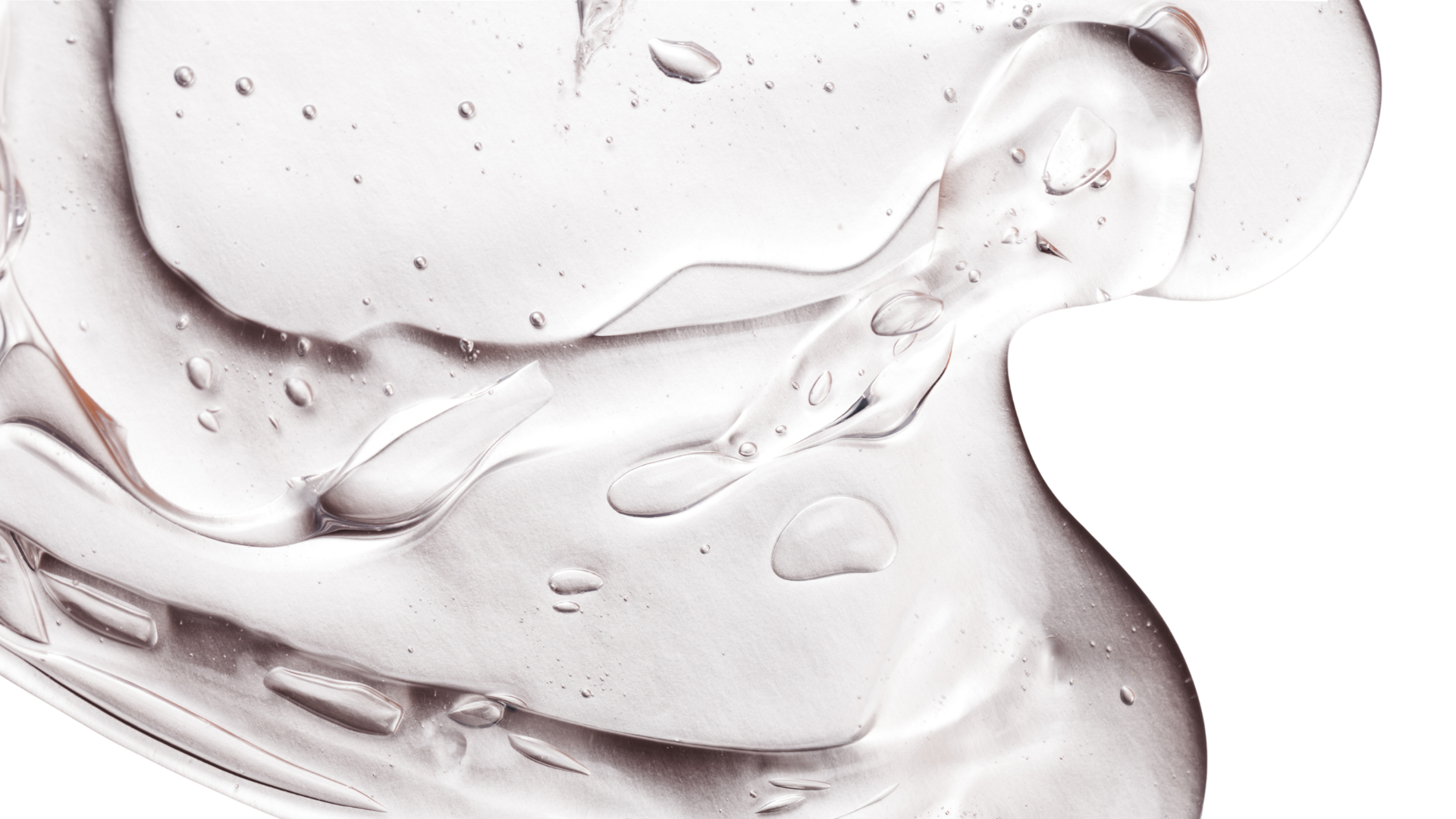 Líquido transparente y gelatinoso con burbujas en un fondo blanco.