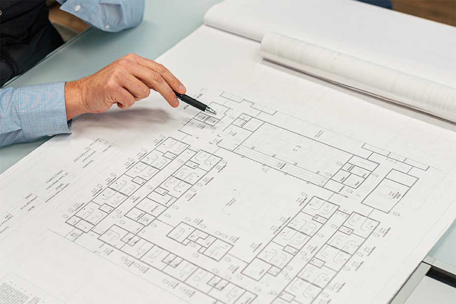 Premier Design Construction reviewing renovation plans during the project planning process