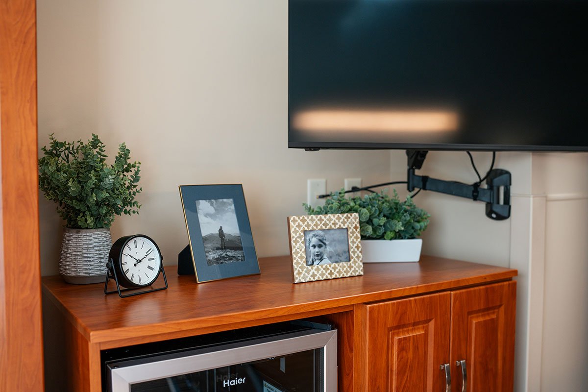 TV cabinet and built-in storage area in a renovated resident room at Hendersonville Health & Rehabilitation