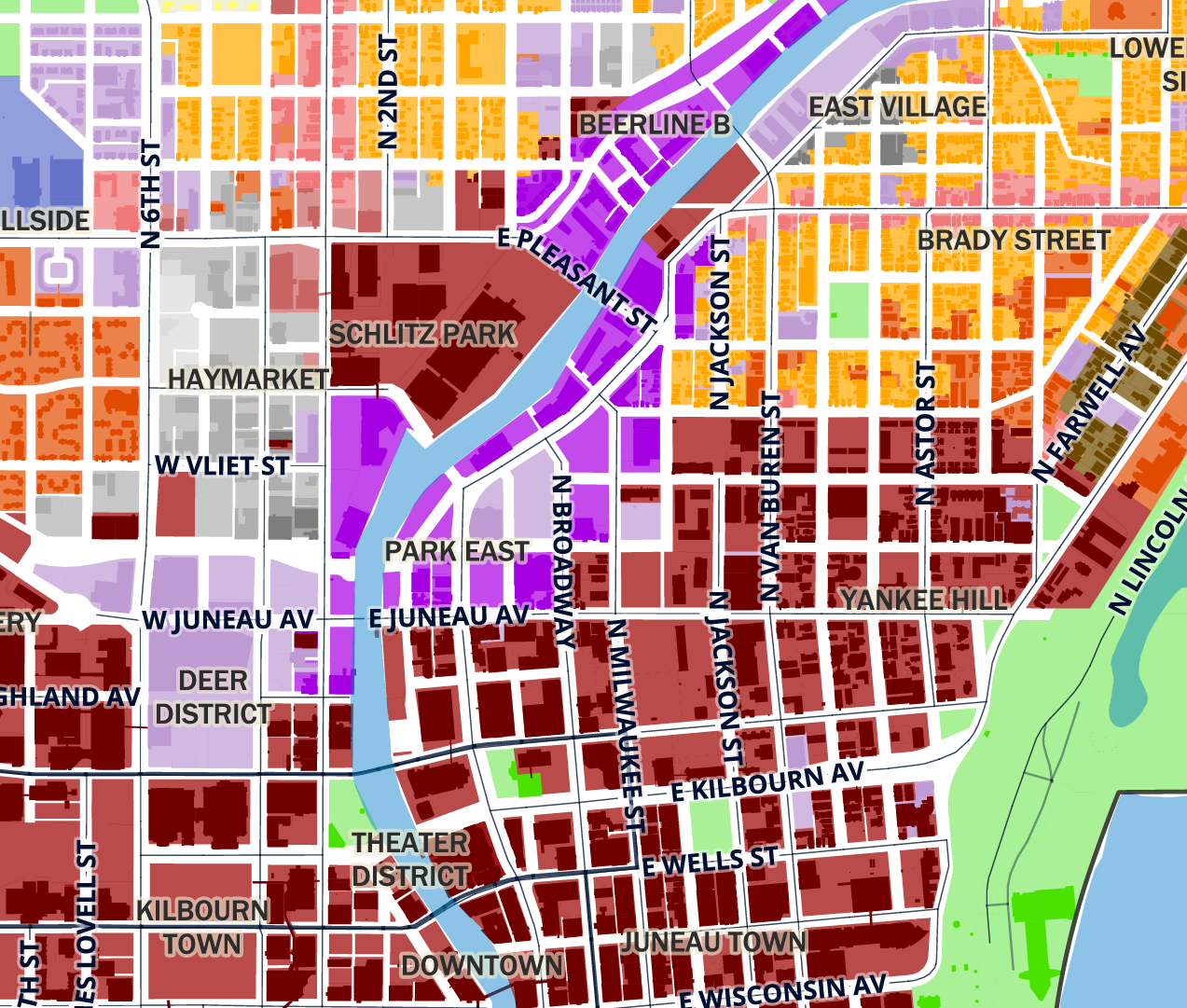 Color-coded map zoning of downtown Milwaukee, Wisconsin, showing neighborhoods, streets, parks, and the Milwaukee River.