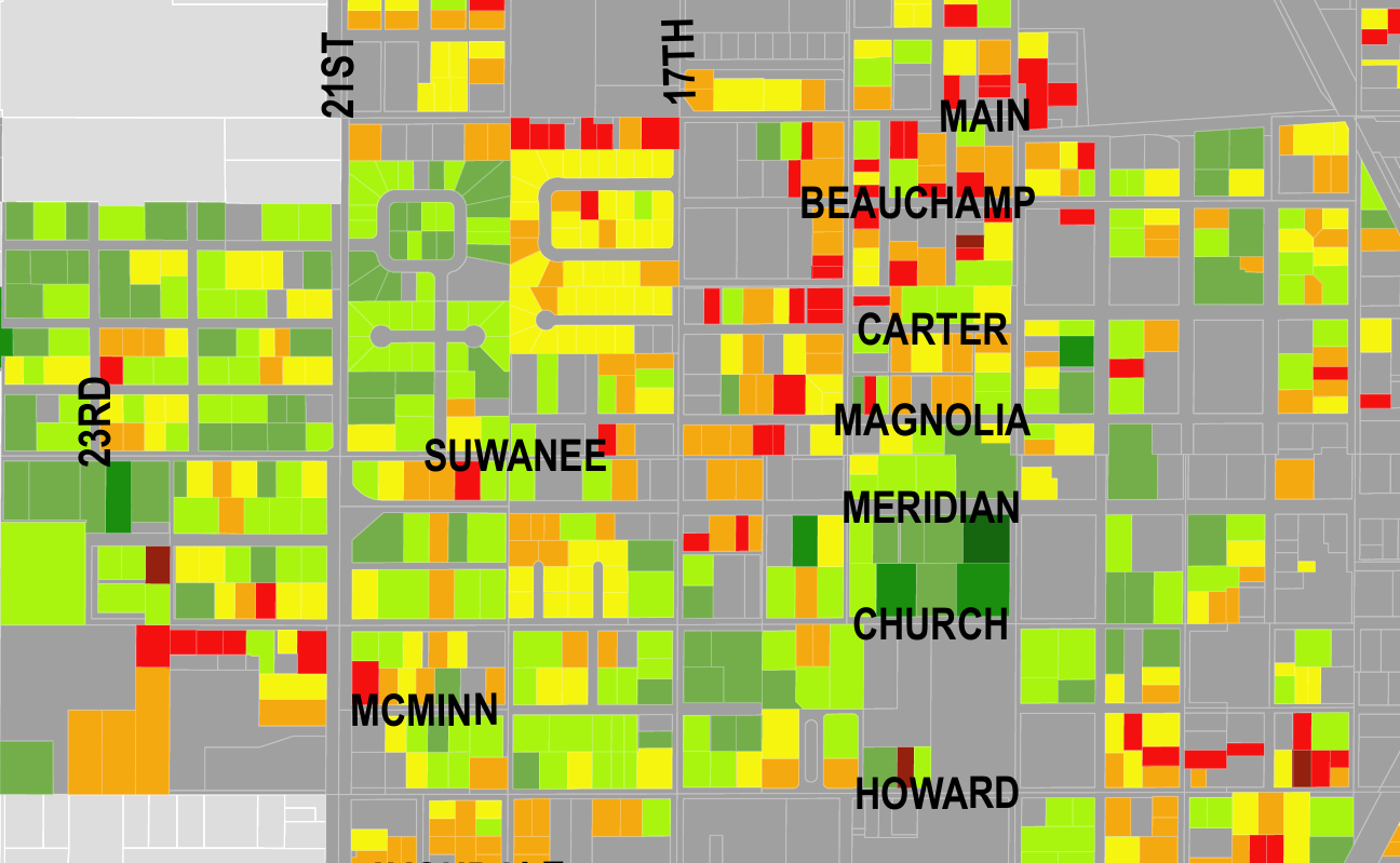 Color-coded map of a neighborhood showing property values with street labels and prominent neighborhood names like SUWANEE, MC MINN, MAIN, BEAUCHAMP, CARTER, MAGNOLIA, MERIDIAN, CHURCH, HOWARD.